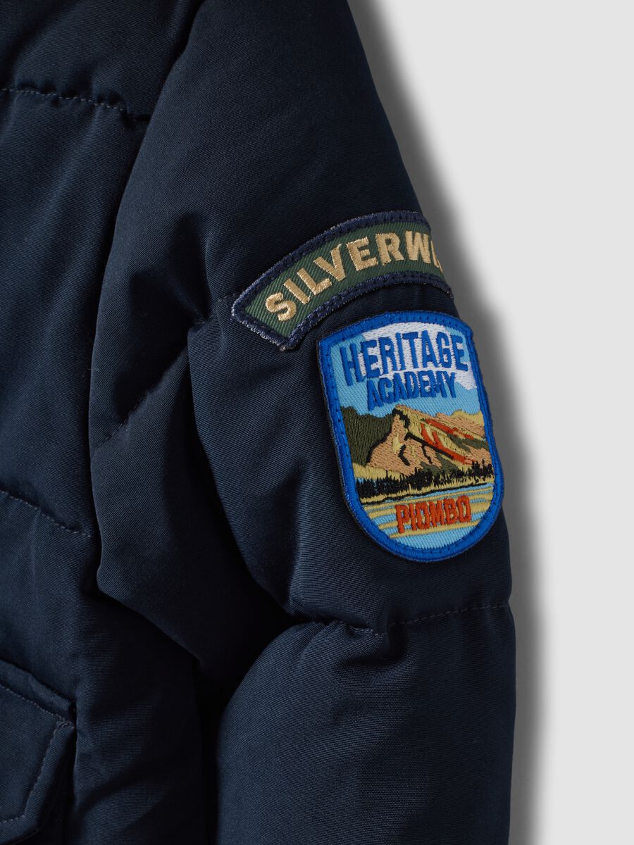 Blue padded jacket with hood and removable trim_2