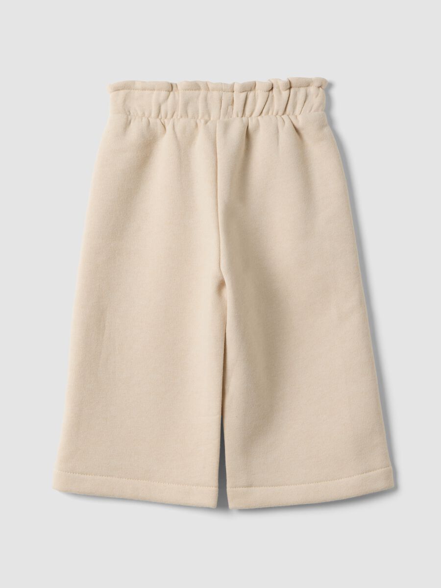 Beige wide-leg cotton-blend trousers_1
