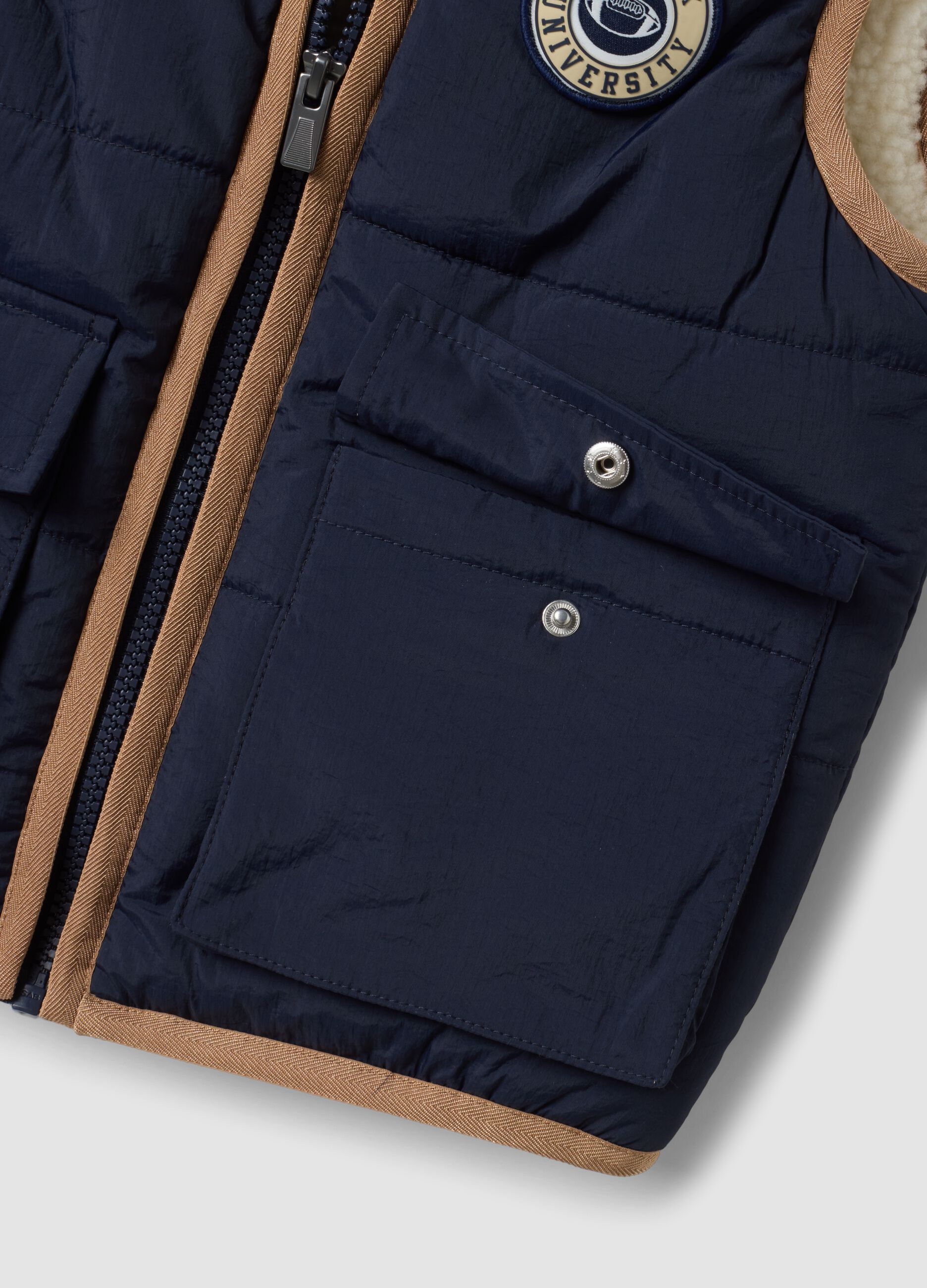 Blue padded gilet with zip and contrast trims