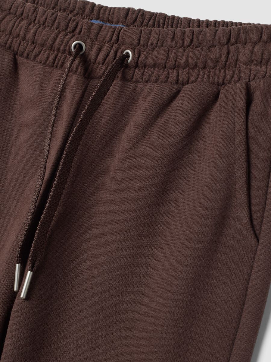 Pantaloni marroni flare in puro cotone organico_1