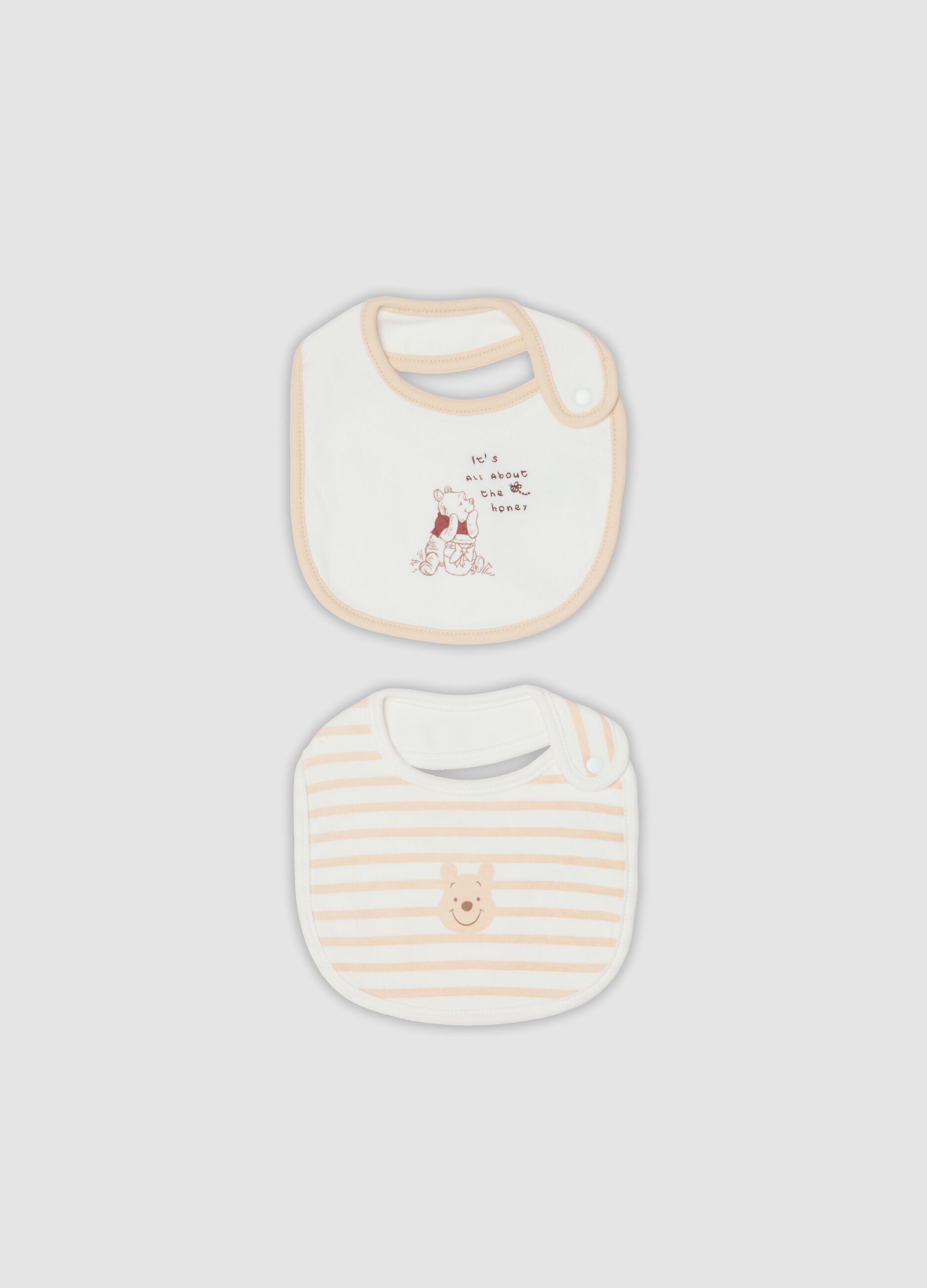2-pack of white organic cotton Winnie the Pooh bibs