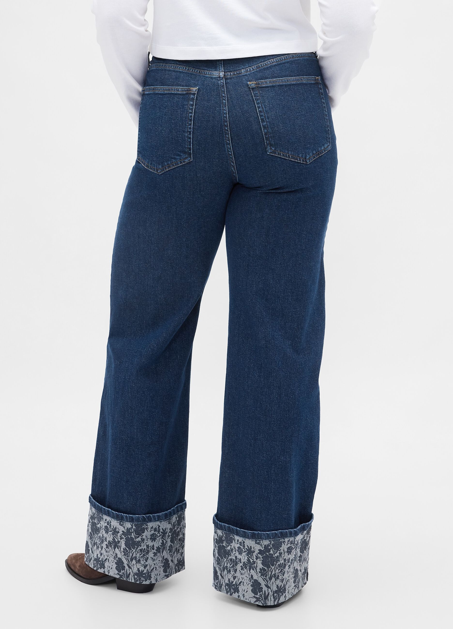 Wide denim trousers with floral turn-up