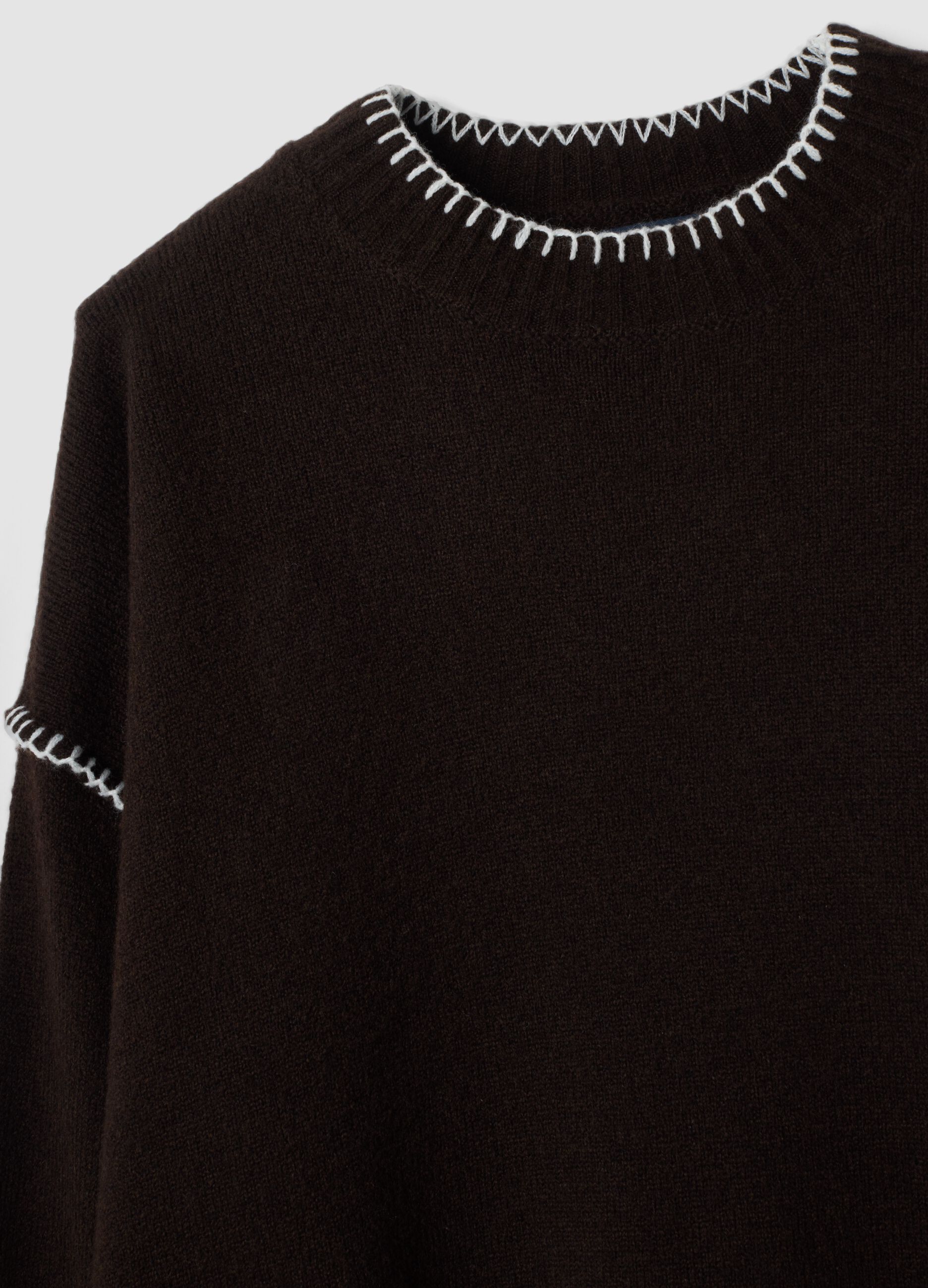 Brown stretch wool jumper with exposed seams, oversized fit