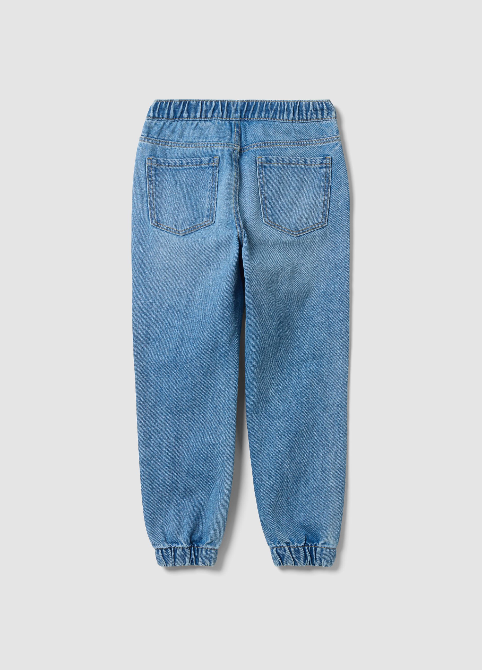 Blue denim jogger jeans in a cotton and viscose blend for boys