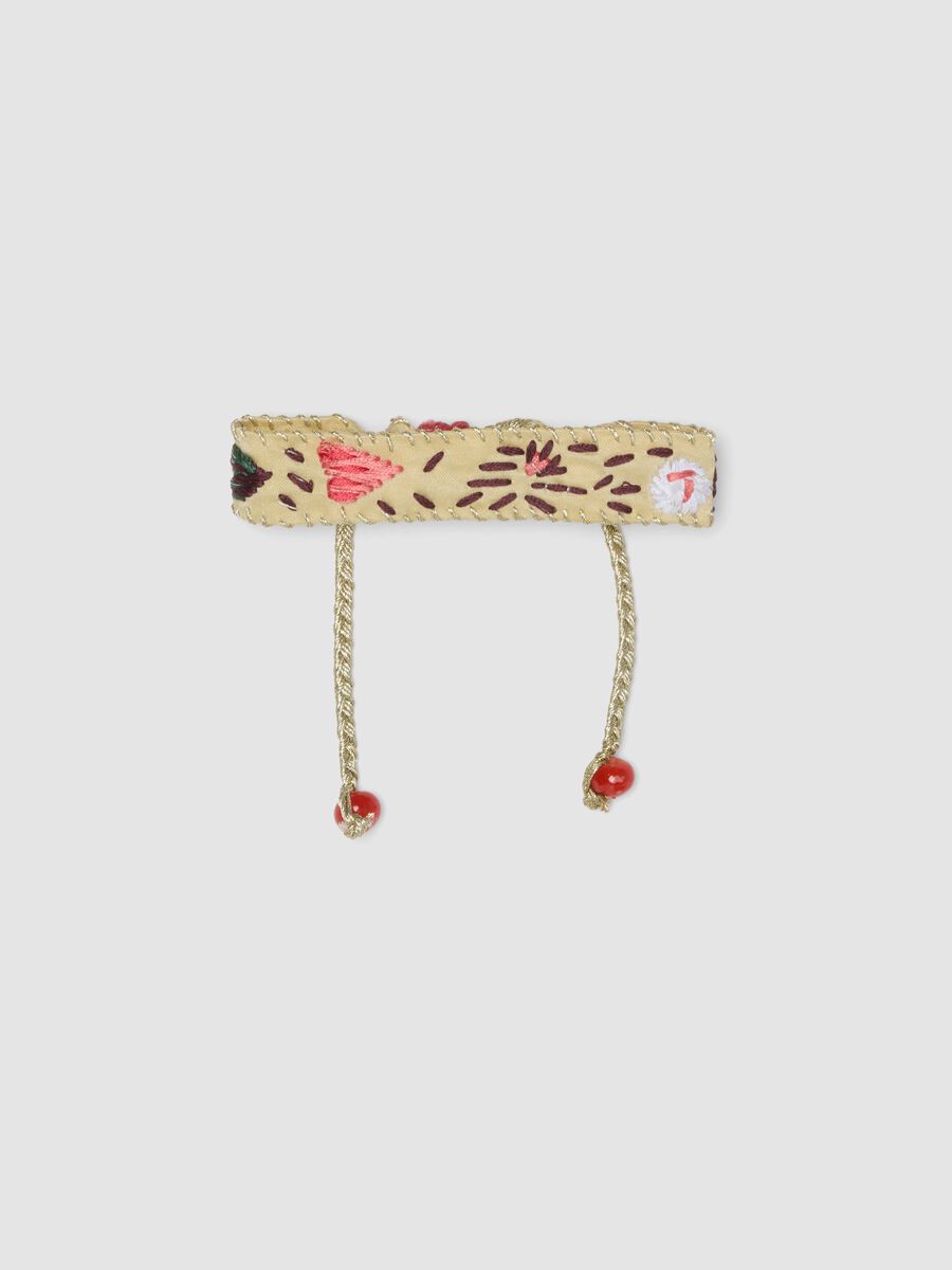 Beige embroidered bracelet with adjustable tie cords_0