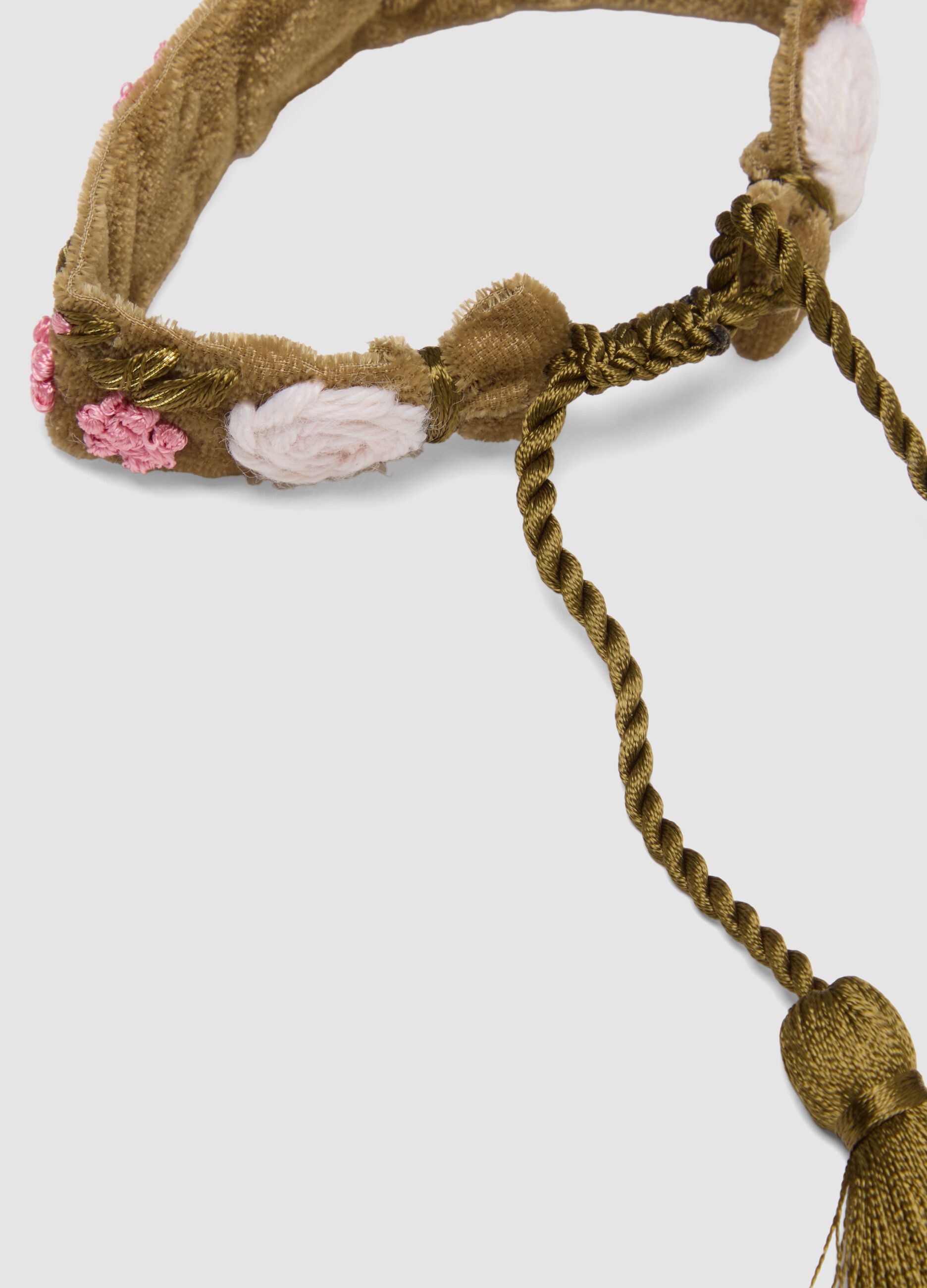 Green bracelet with embroidered flowers and tassels