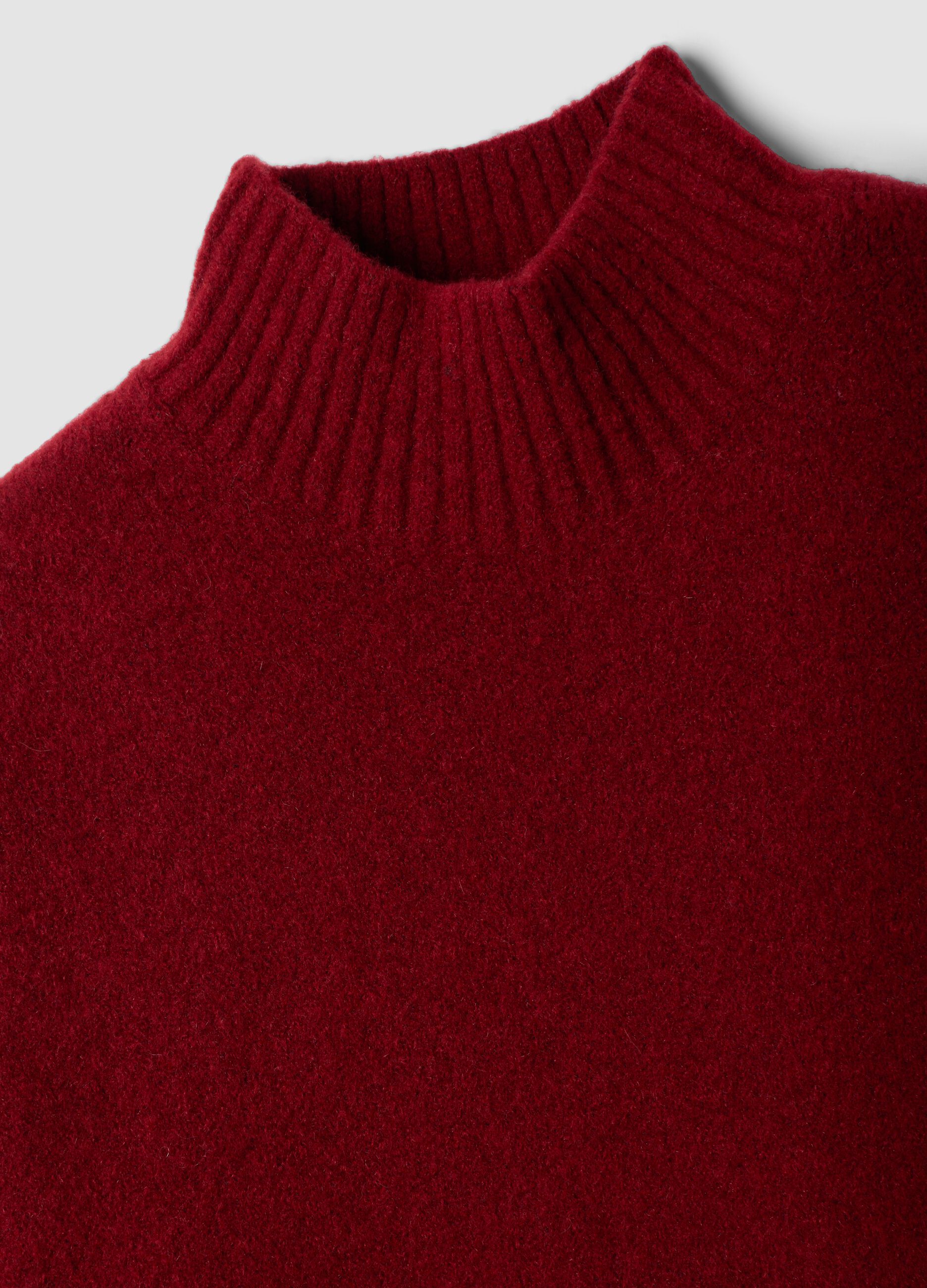 Red stretch wool jumper with raised neck