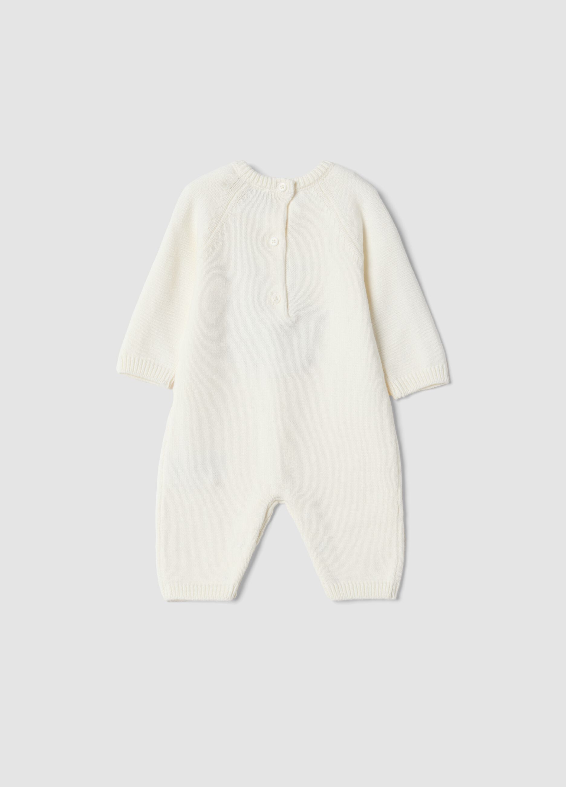 White 100% organic cotton baby sleepsuit with animal print