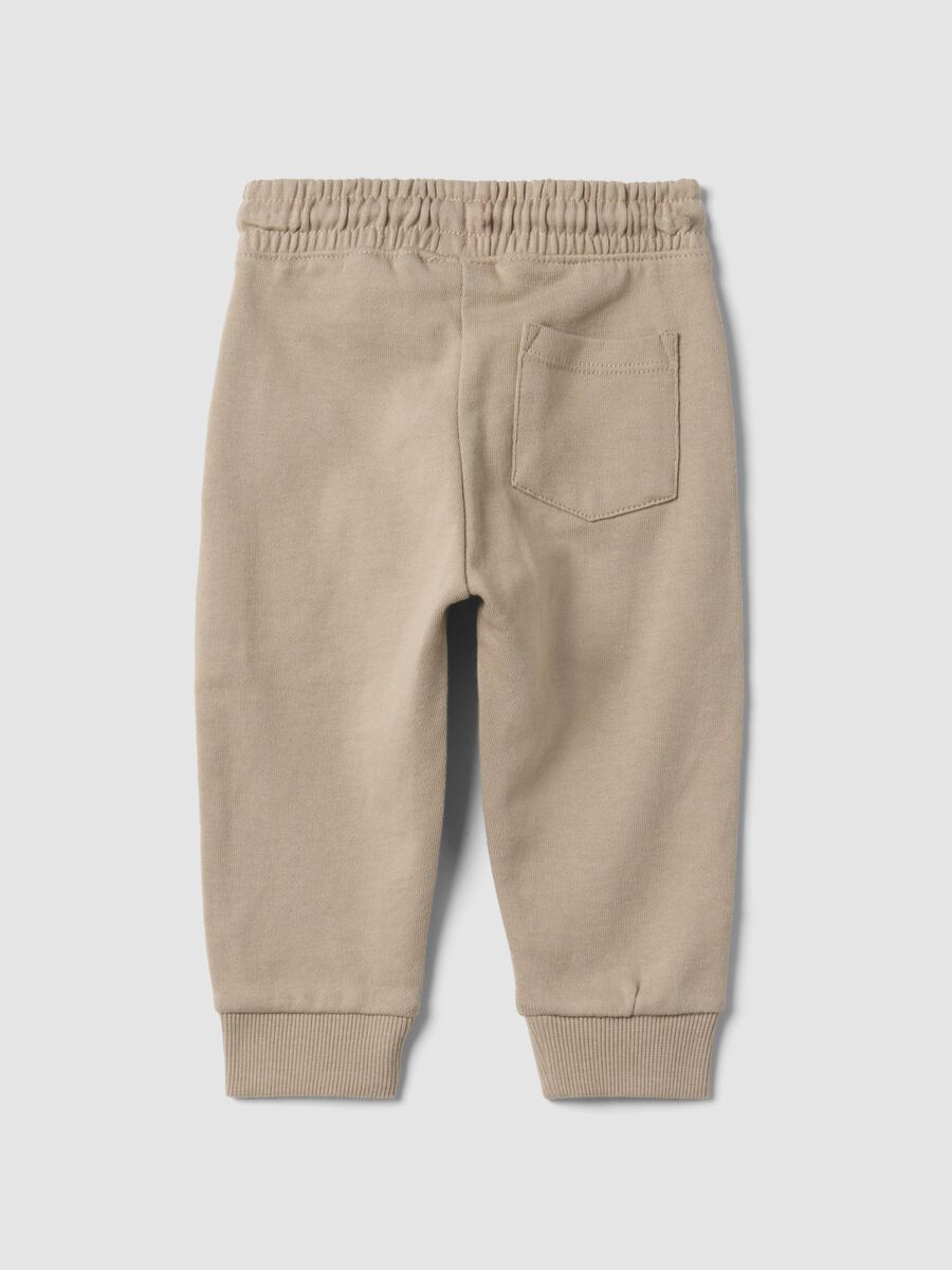 Beige pure cotton joggers with puppy print for baby boy_1