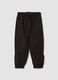 Black cotton-blend joggers with ankle zips_0