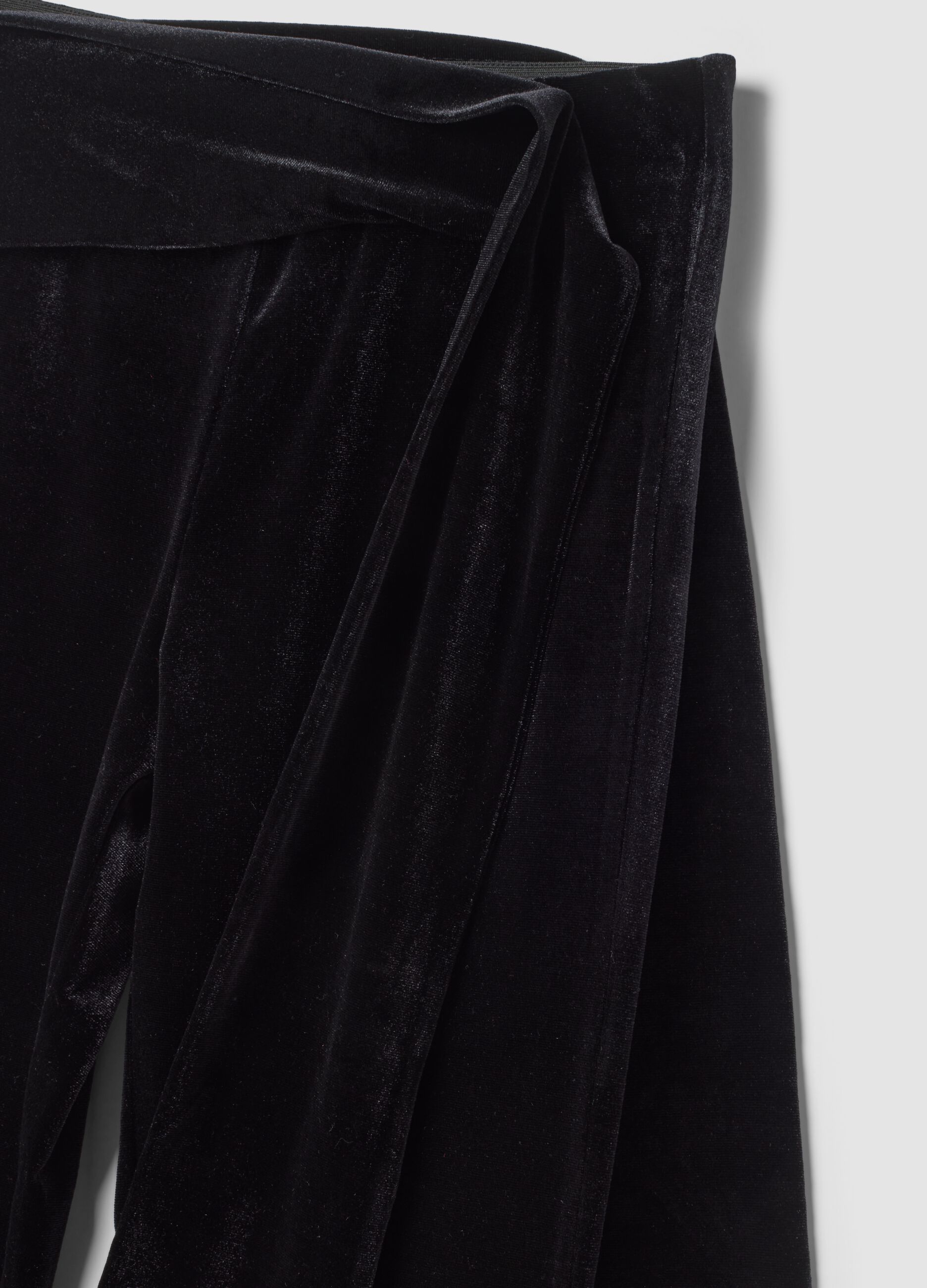 Black velour flare trousers in stretch fabric with side bow detail