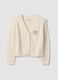 Beige cotton-blend fitted cardigan with deep V-neck_0