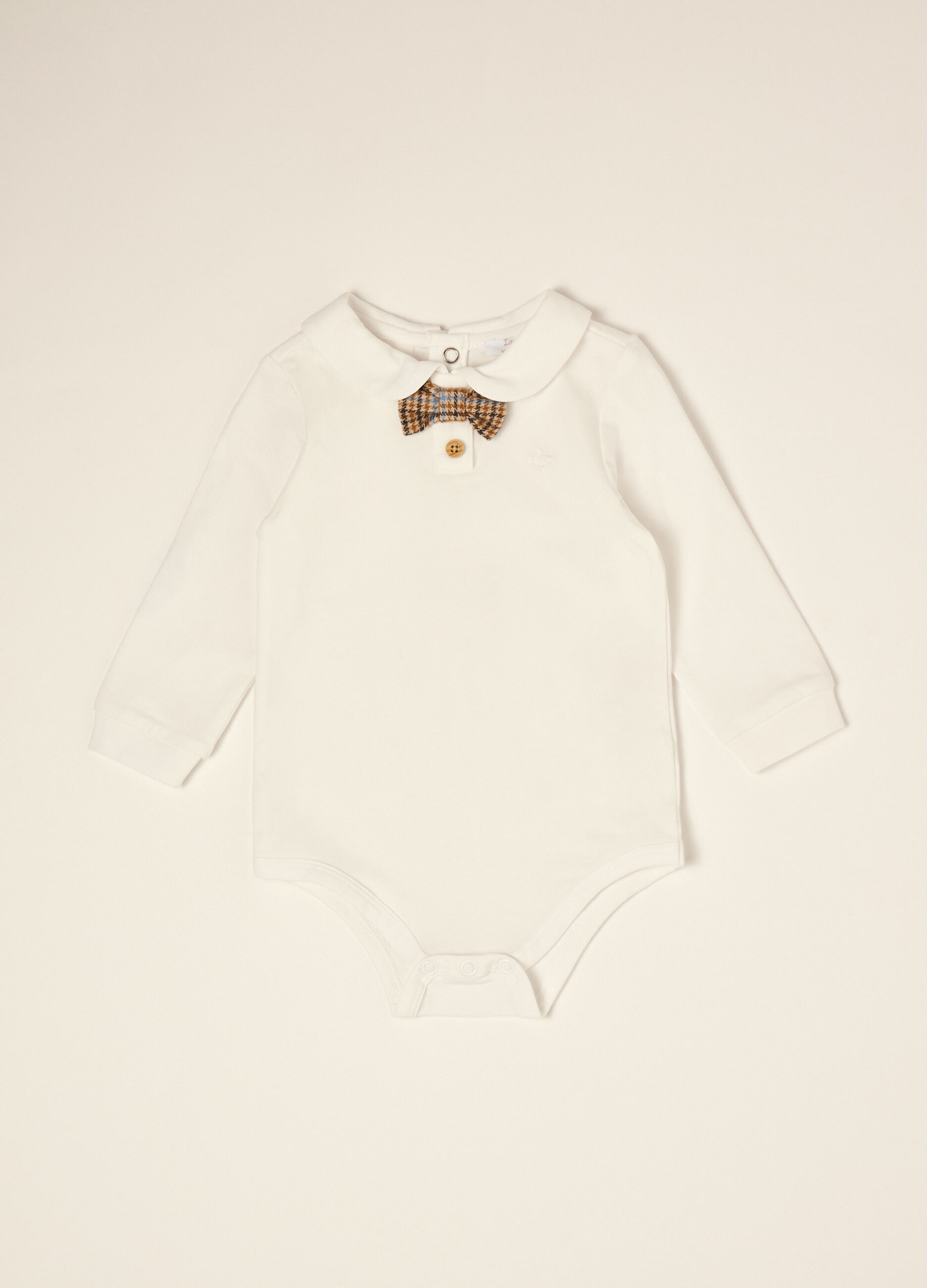 White organic stretch cotton baby bodysuit with bow