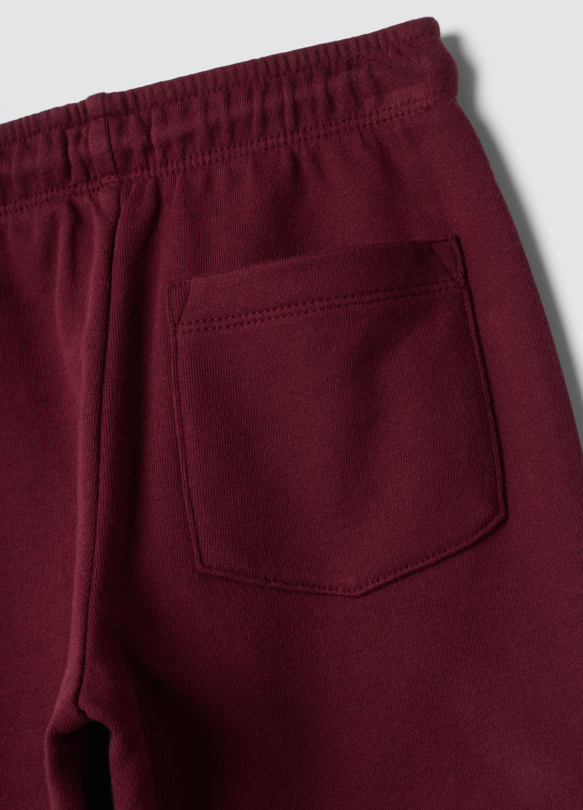 Pantaloni jogger rossi in puro cotone con stampa