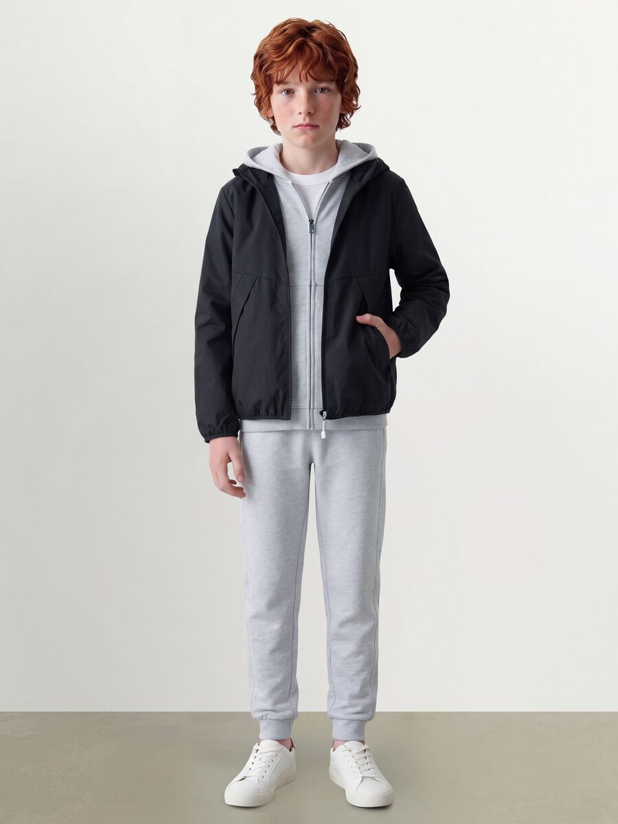 Black oversized rain jacket with hood and zip for boys_1