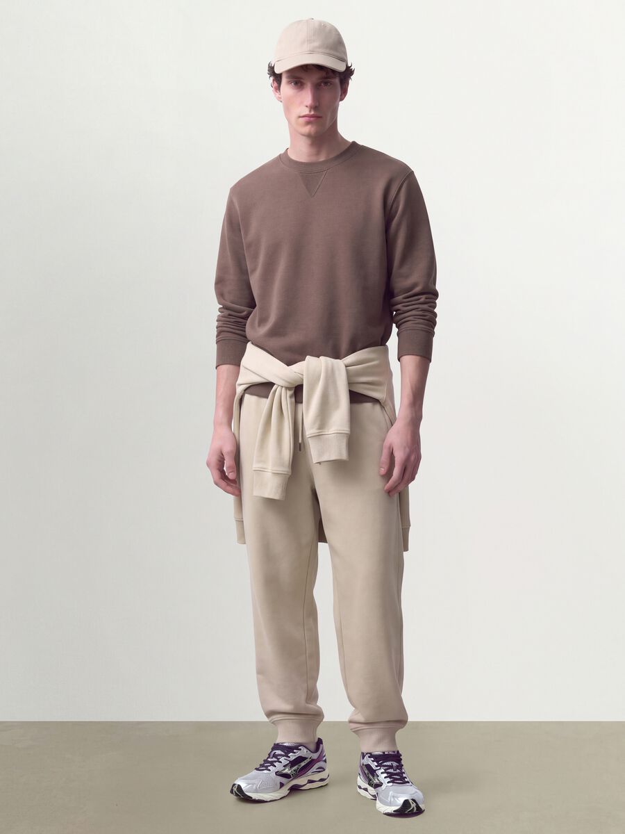 Beige cotton-blend joggers with cuffed hems and drawstring_0
