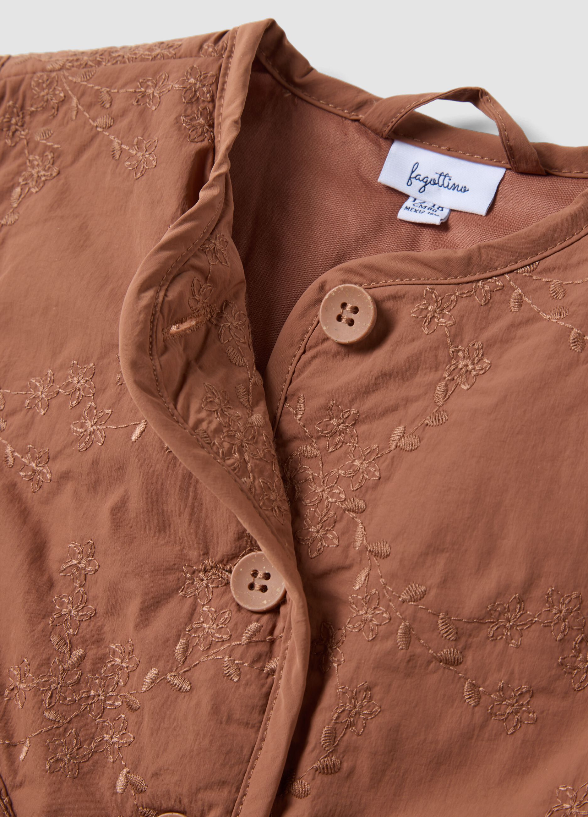 Brown padded gilet with floral embroidery