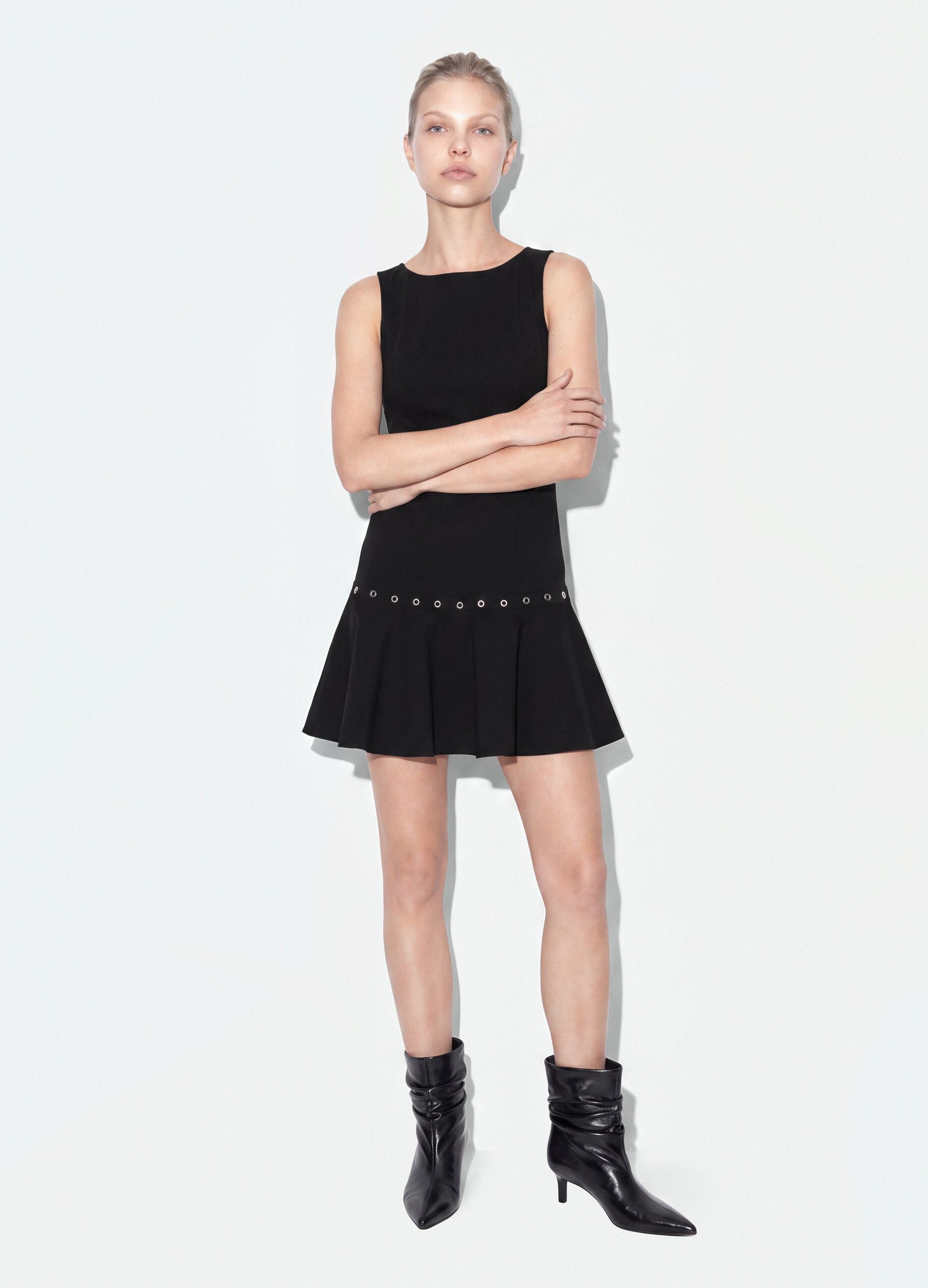 Black sleeveless stretch viscose dress with eyelet detail