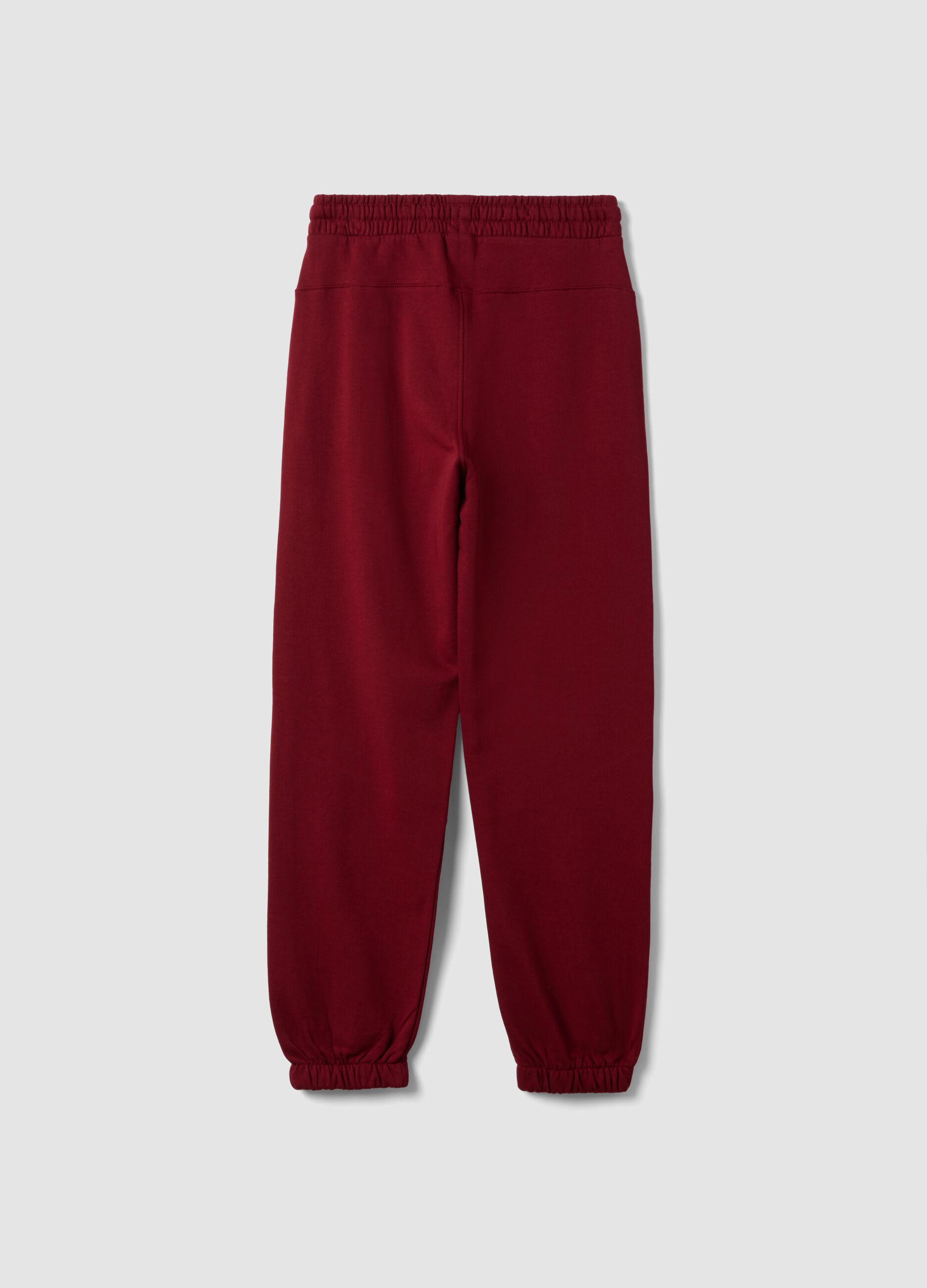 Red relaxed-fit joggers in pure organic cotton with check print
