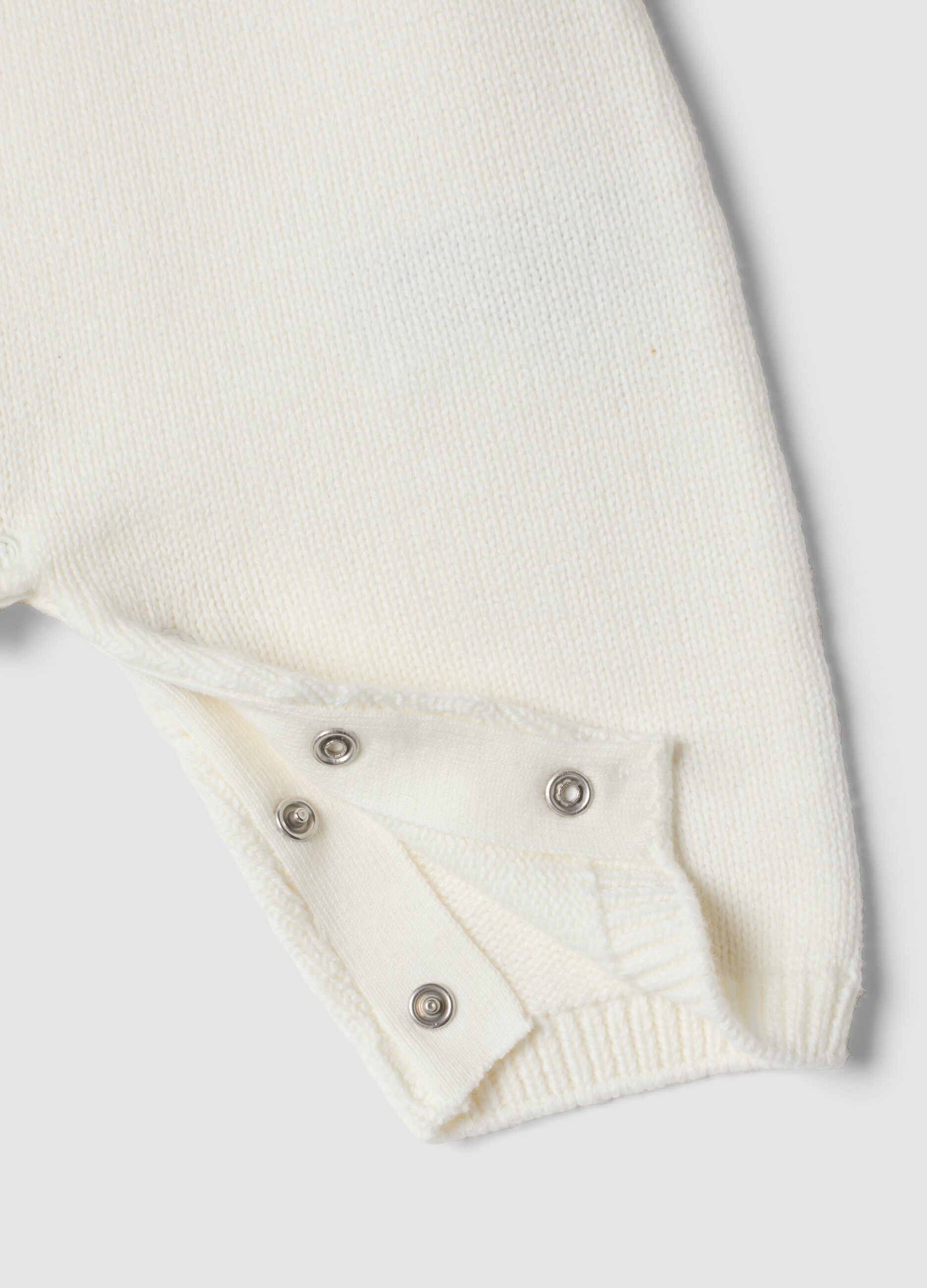 White 100% organic cotton baby sleepsuit with animal print