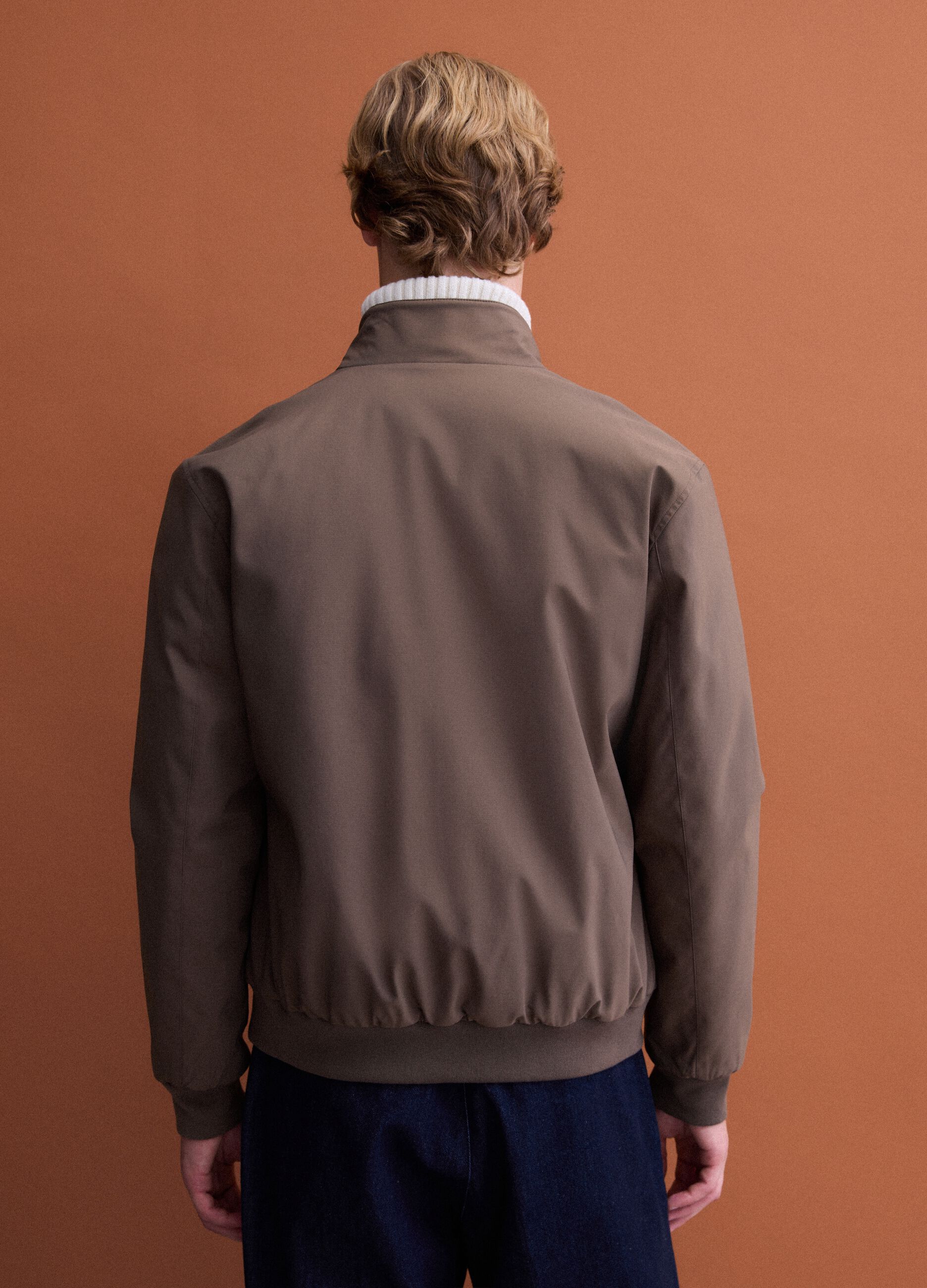 Green padded jacket in a regular fit with zip and high collar