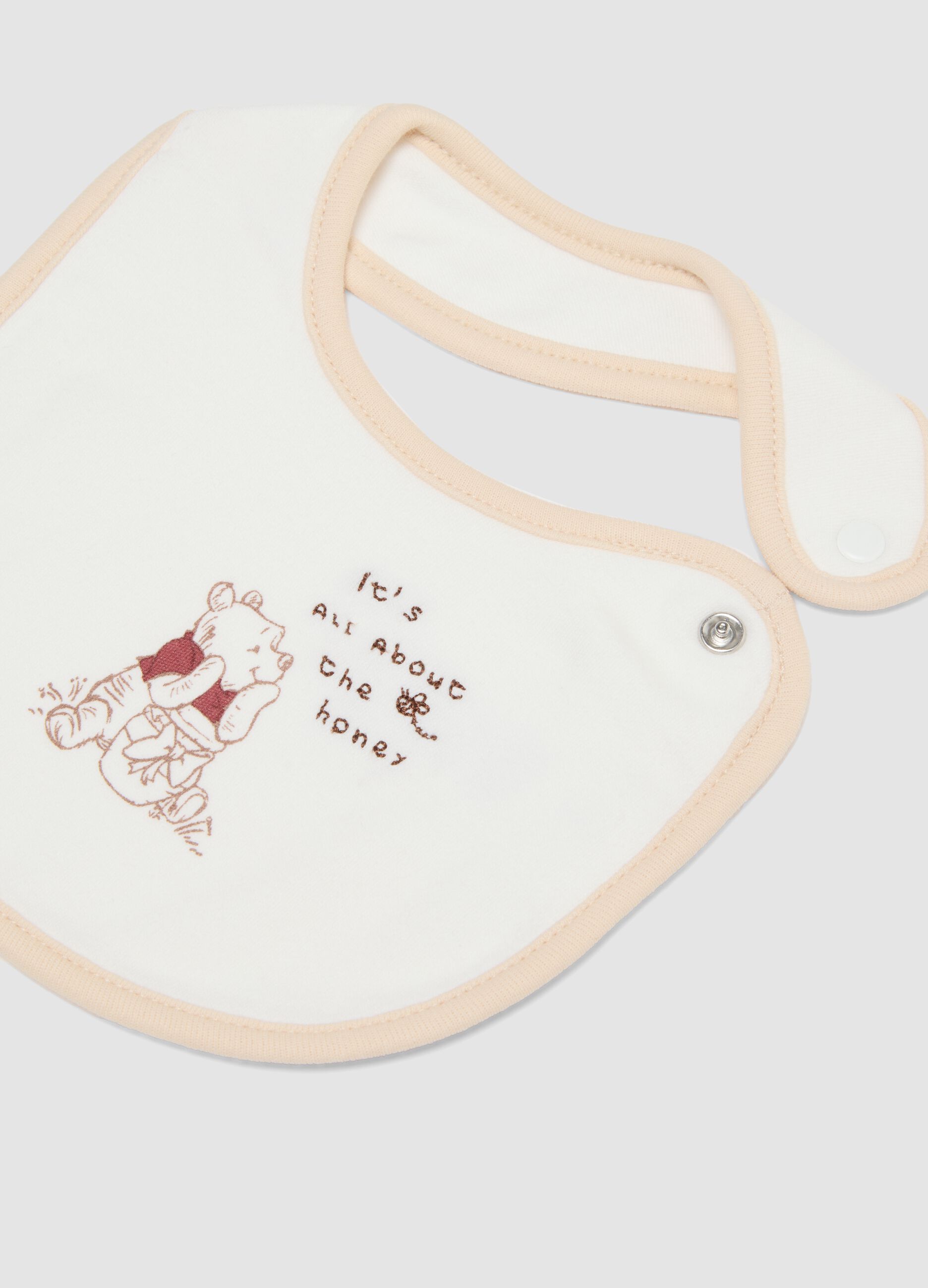 2-pack of white organic cotton Winnie the Pooh bibs