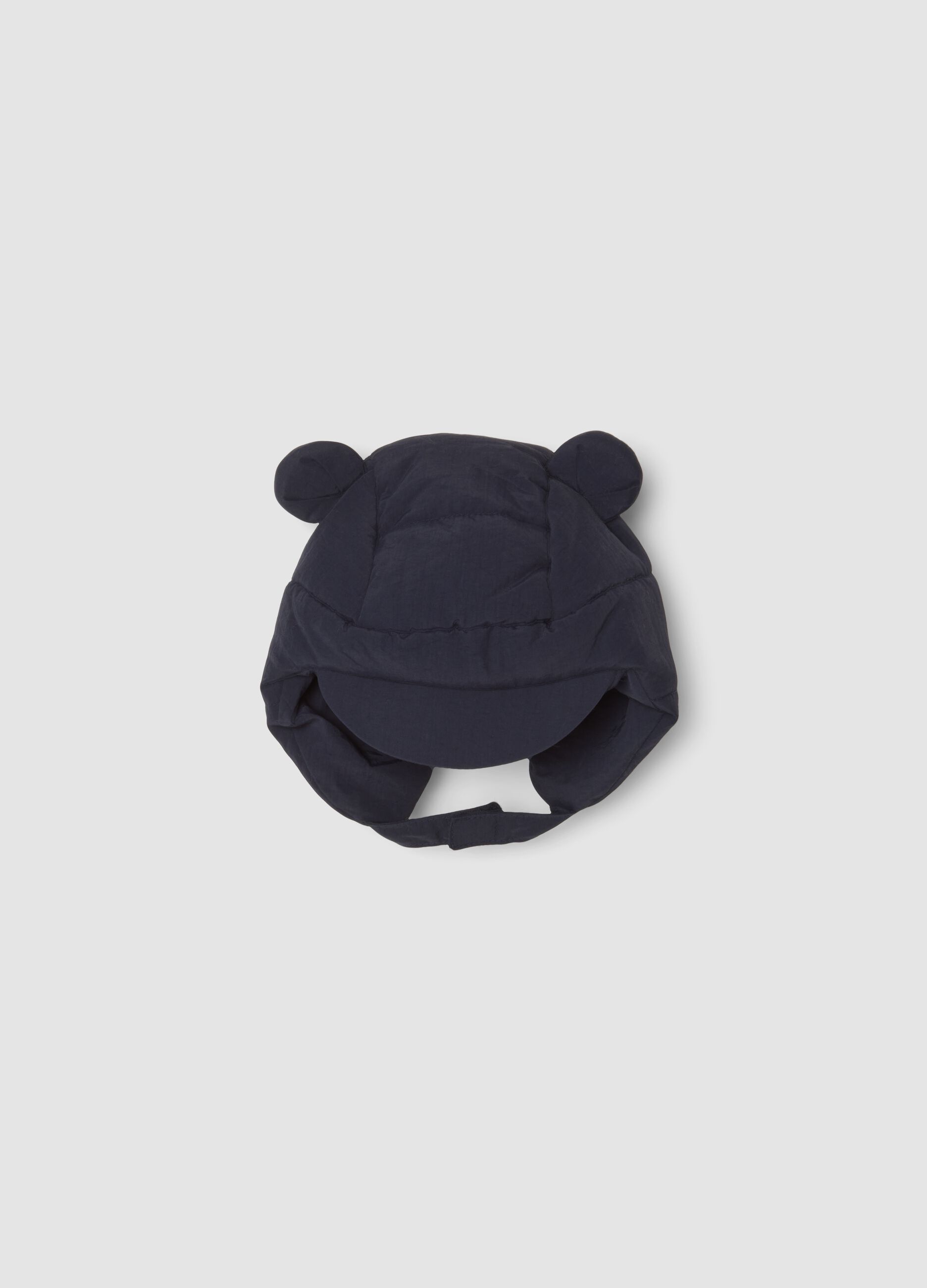 Cappello blu notte imbottito con visiera e paraorecchie