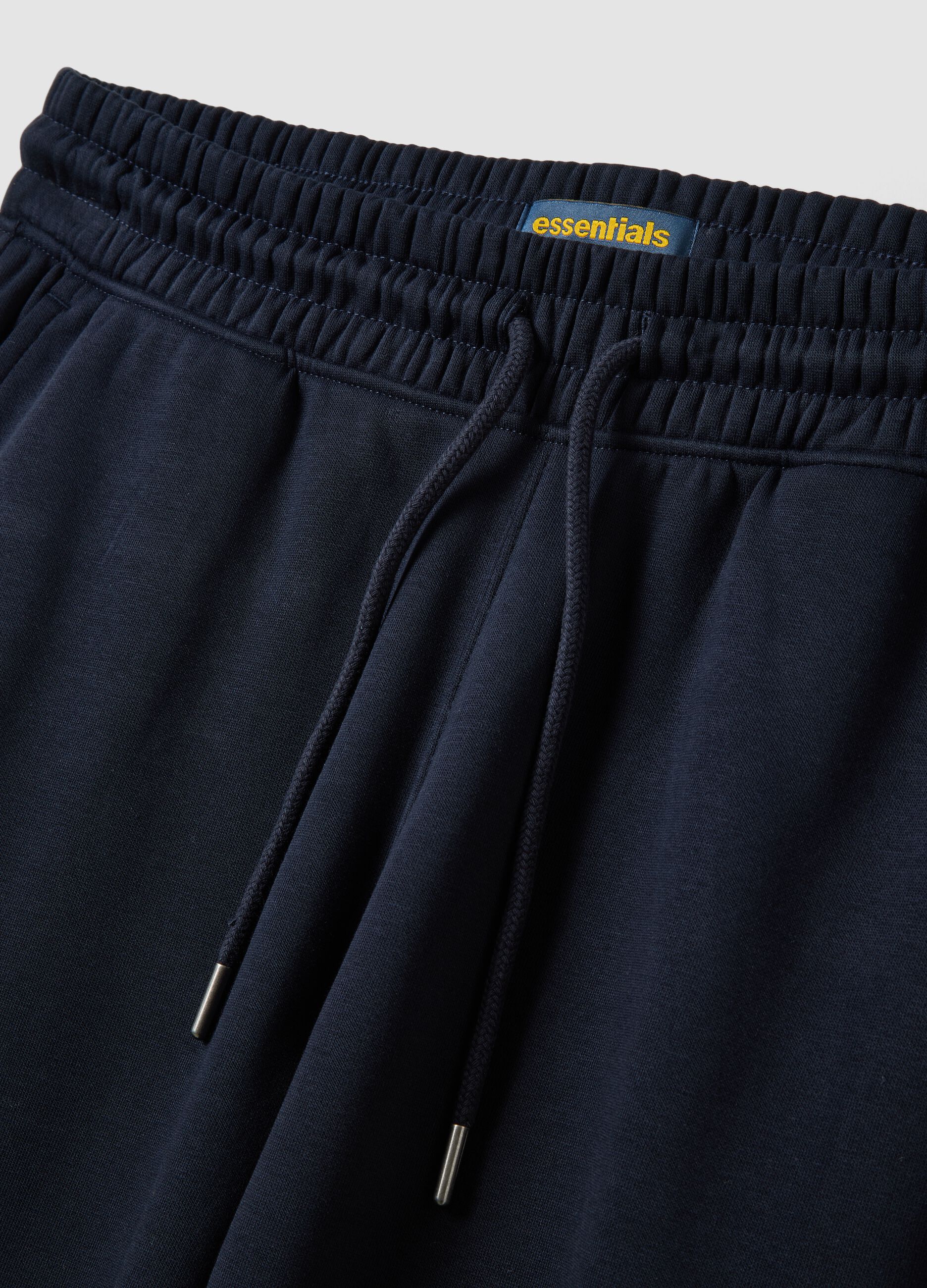 Blue cotton-blend joggers with cuffed hem and drawstring