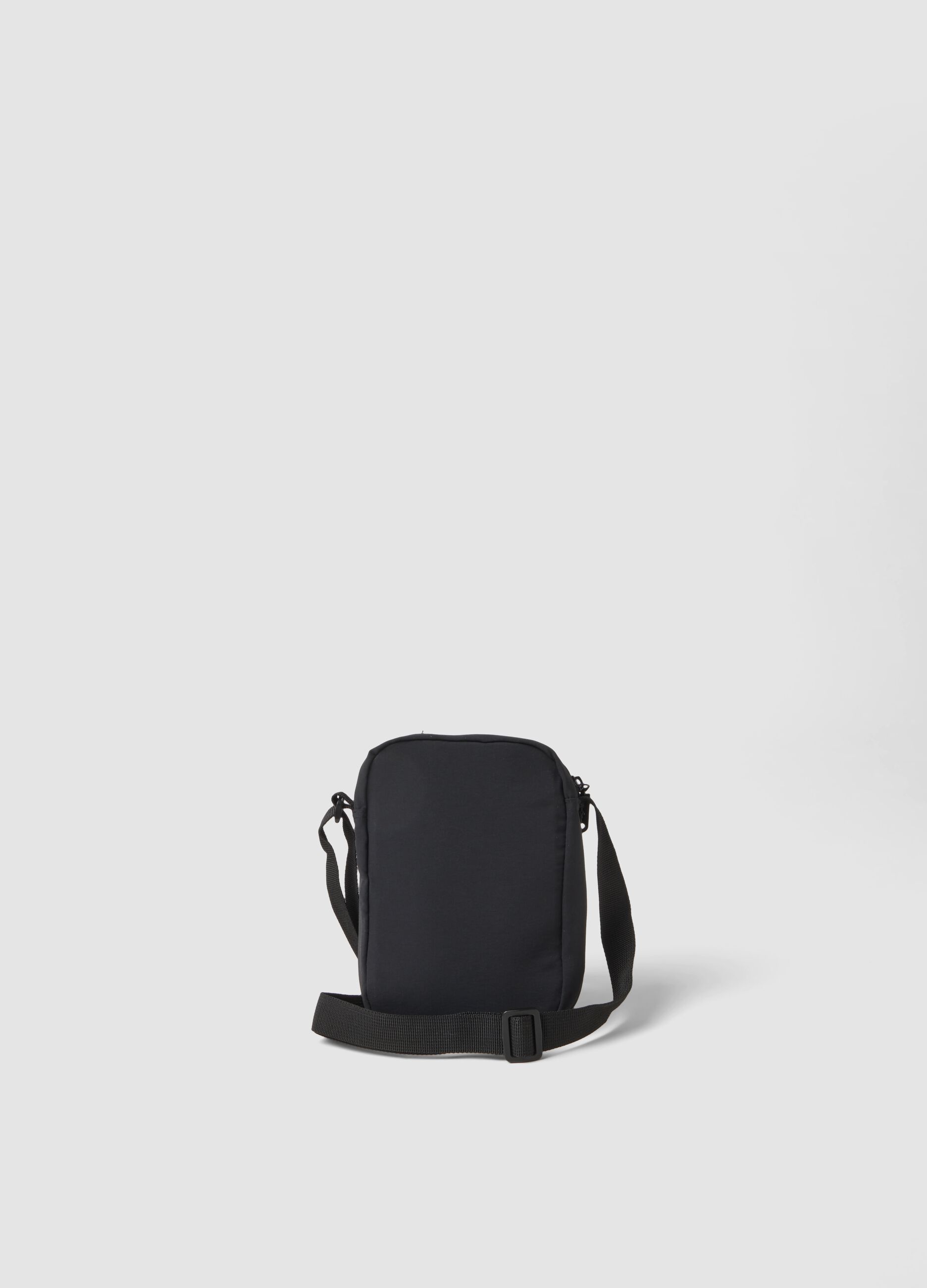 Black crossbody bag with zip closure and adjustable strap