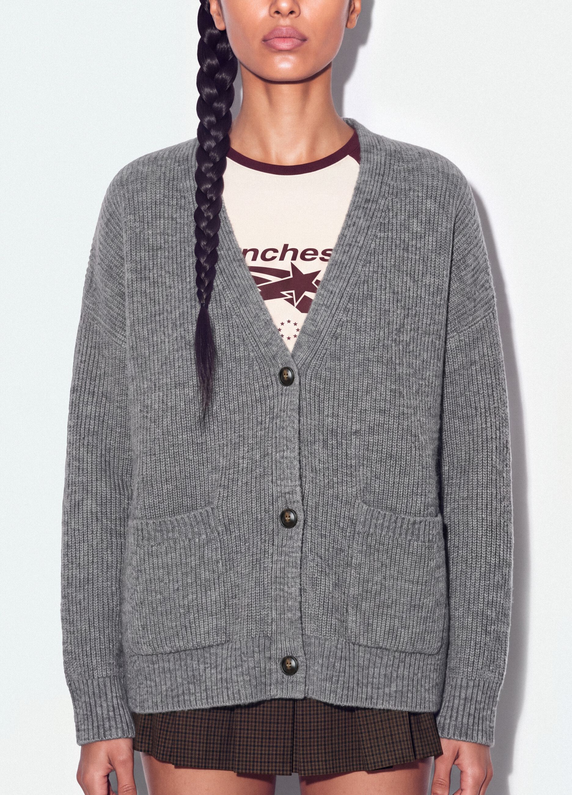 Cardigan grigio in tessuto elasticizzato con scollo profondo a V