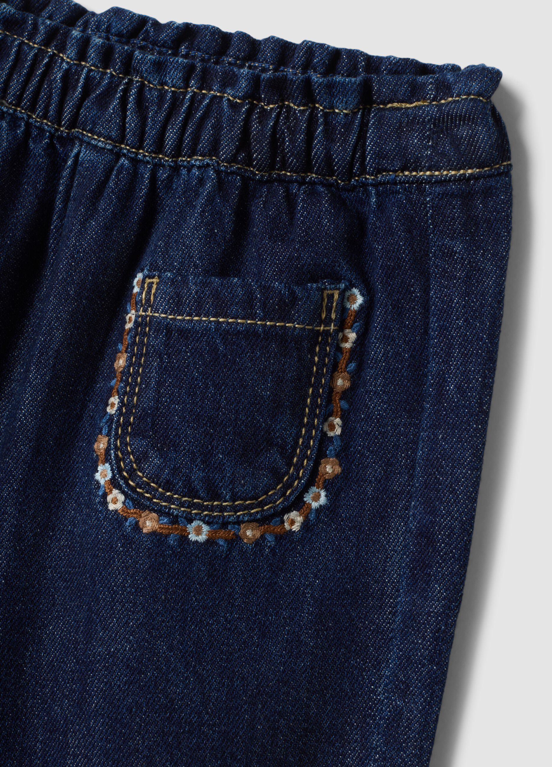 Blue denim joggers in cotton-viscose blend with floral embroidery, comfort fit