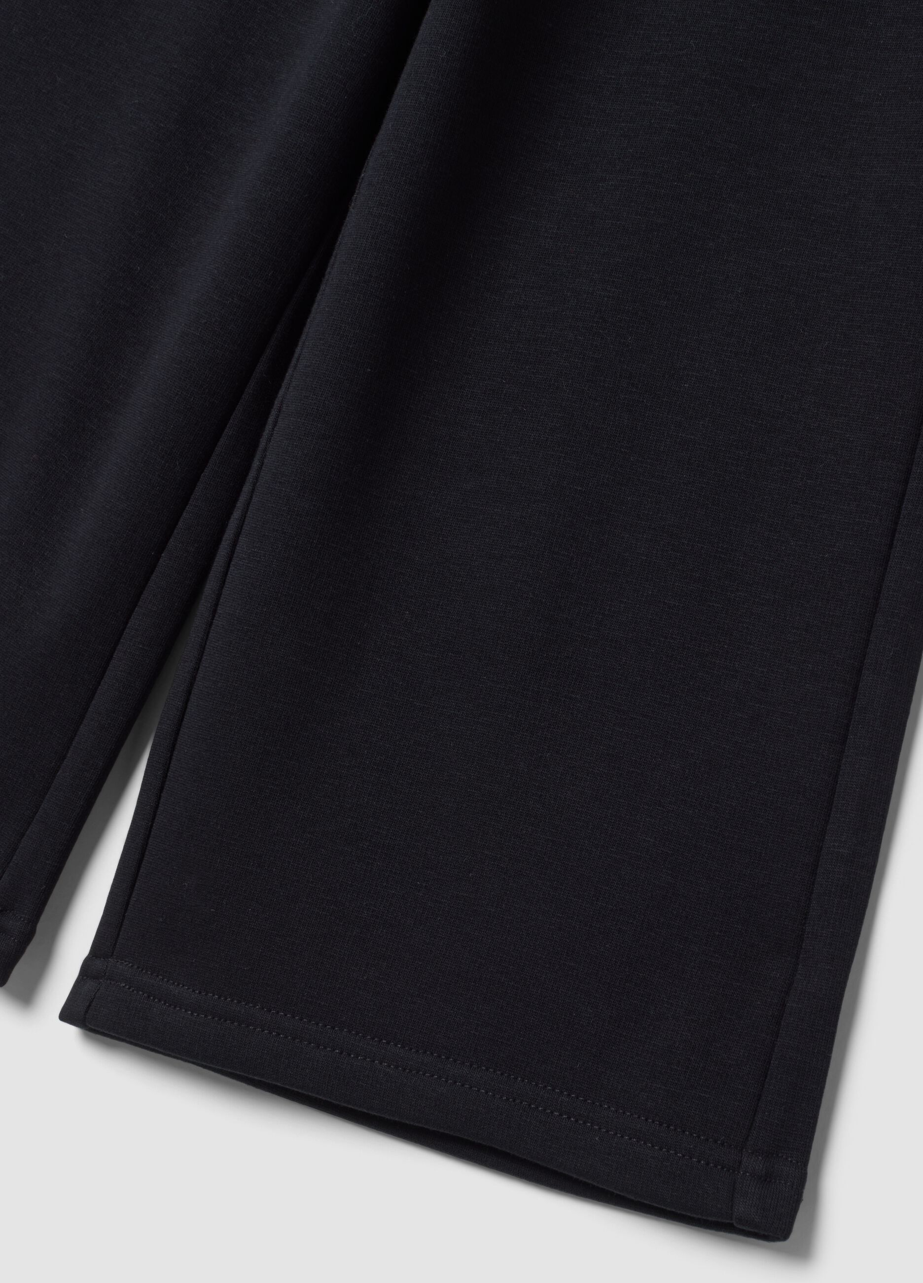 Pantaloni neri wide leg in tessuto fleece elasticizzato