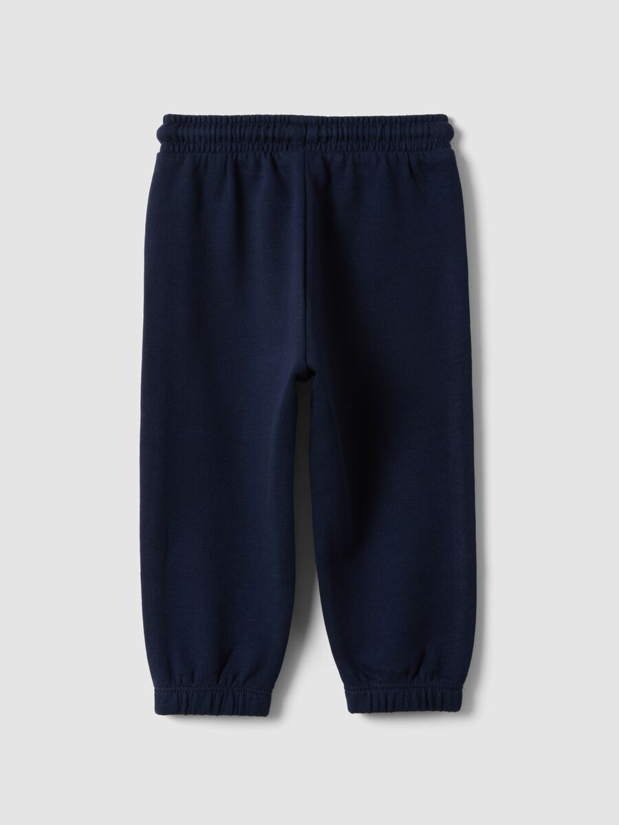 Blue organic cotton jogger trousers with drawstring for baby boy_1