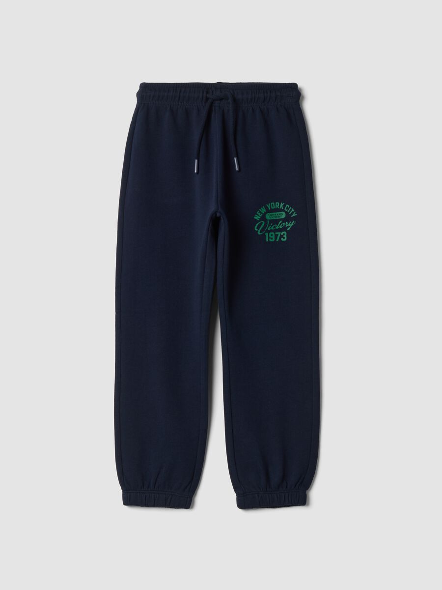 Pantaloni jogger blu in puro cotone con stampa_0