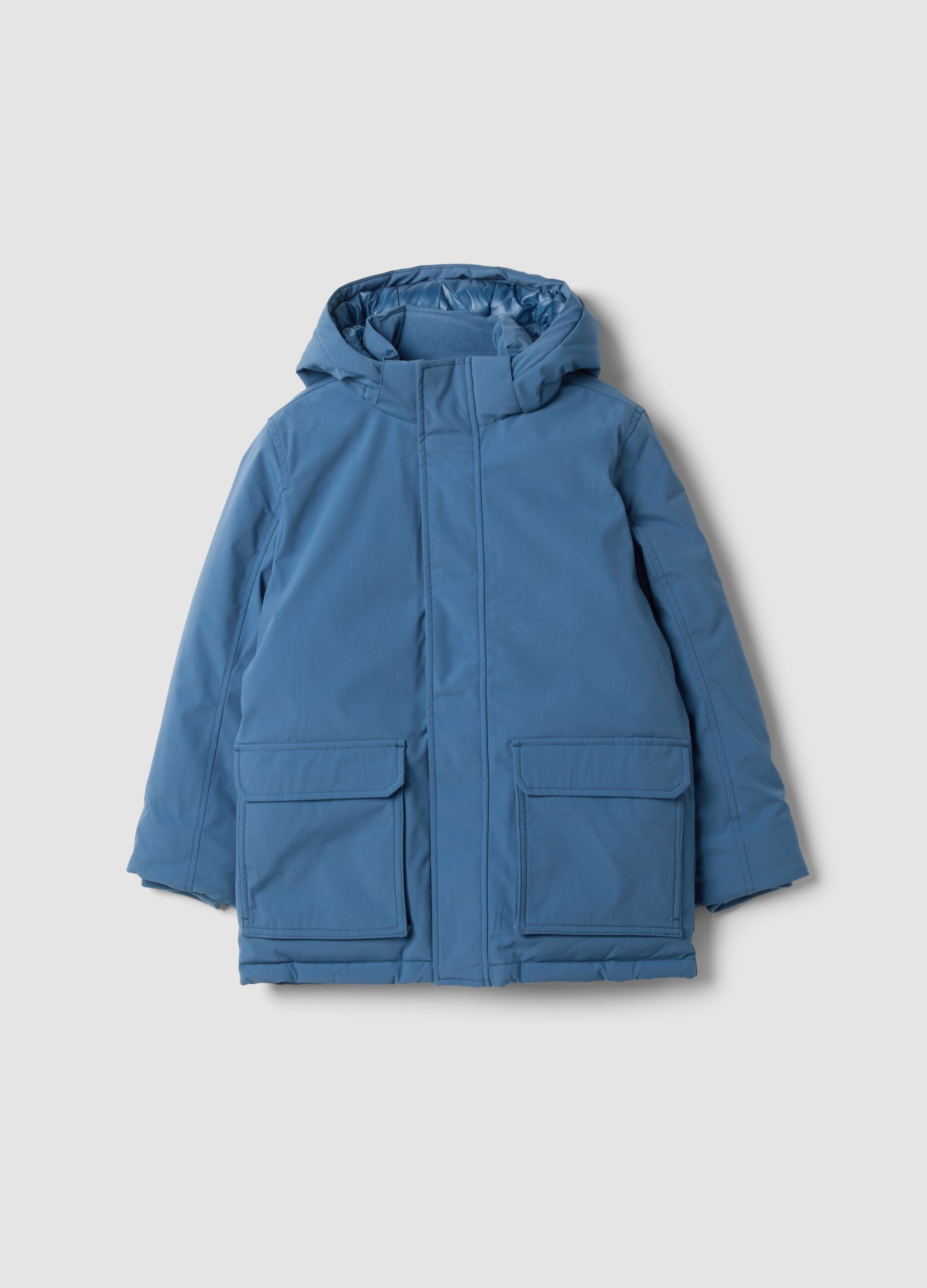 Long padded blue parka with detachable hood, oversized fit
