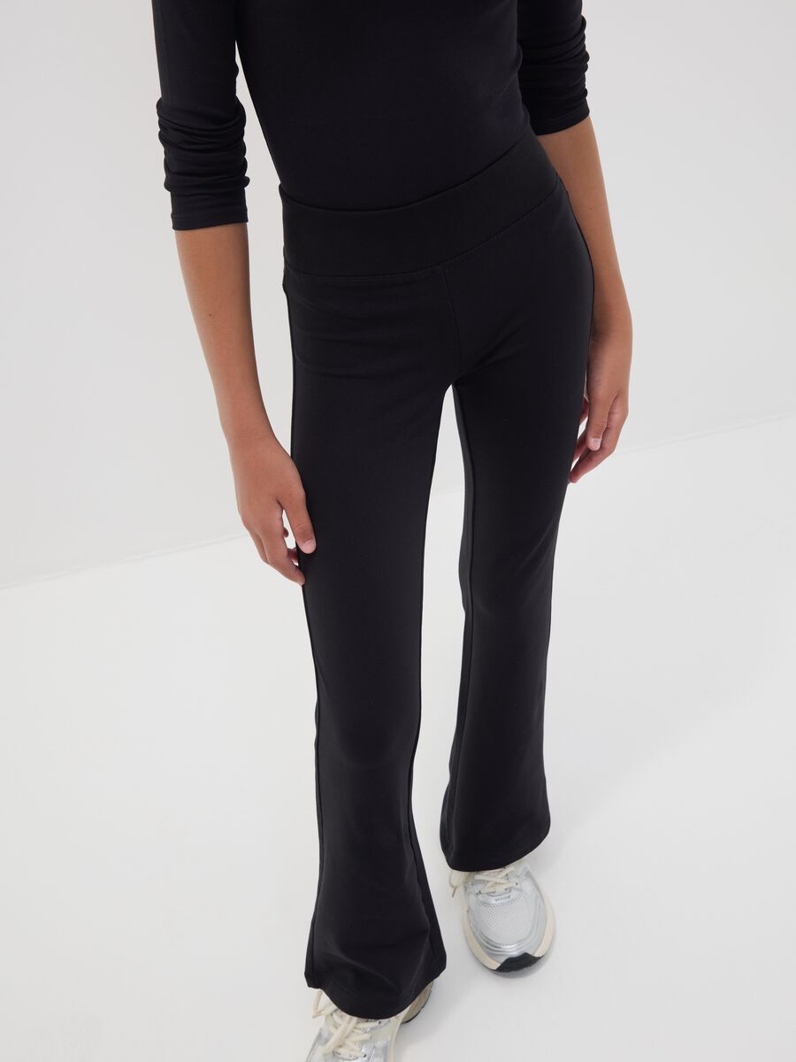 Black flared stretch organic cotton trousers for girls_1