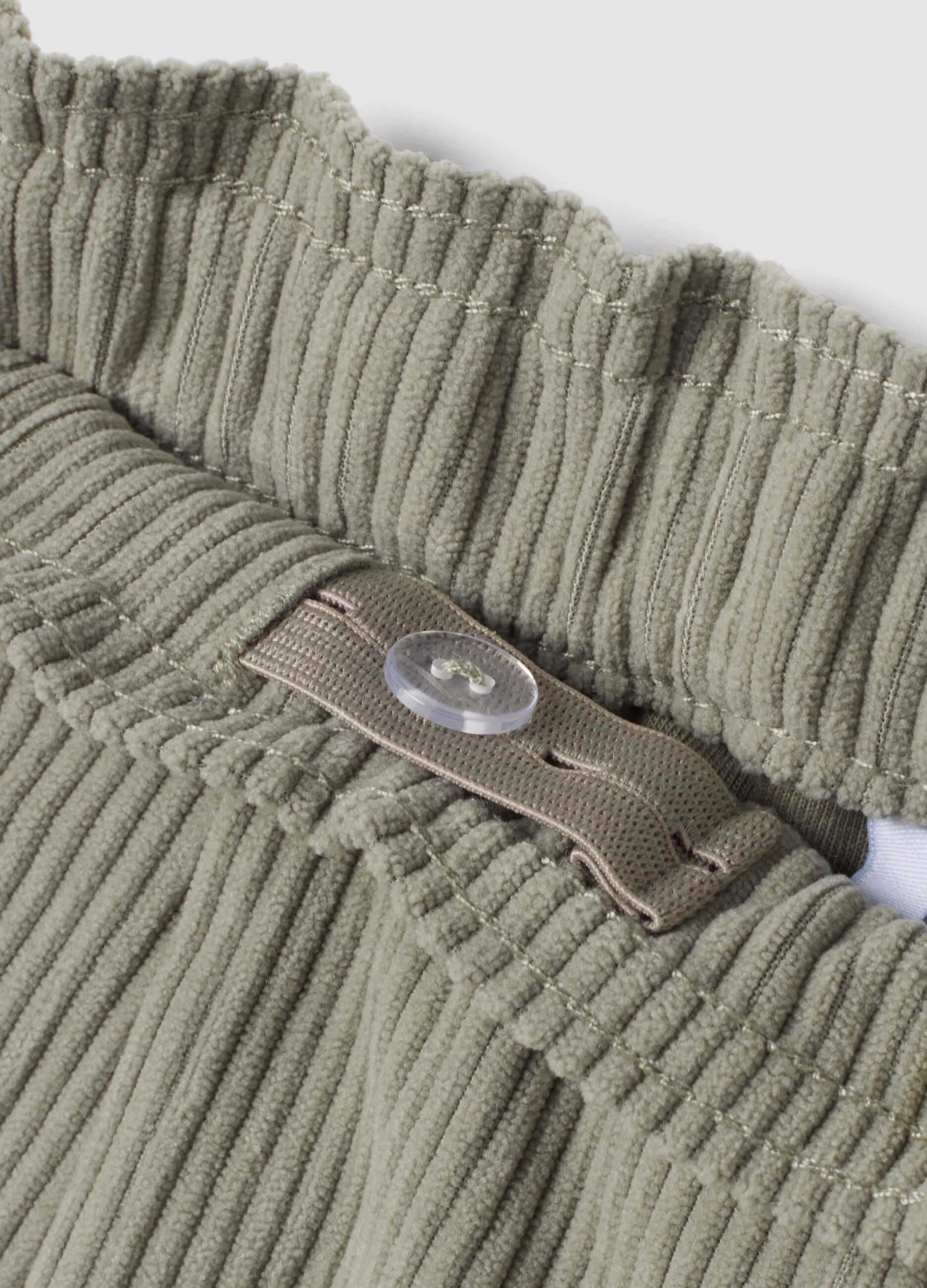 Grey ribbed trousers with elasticated waistband