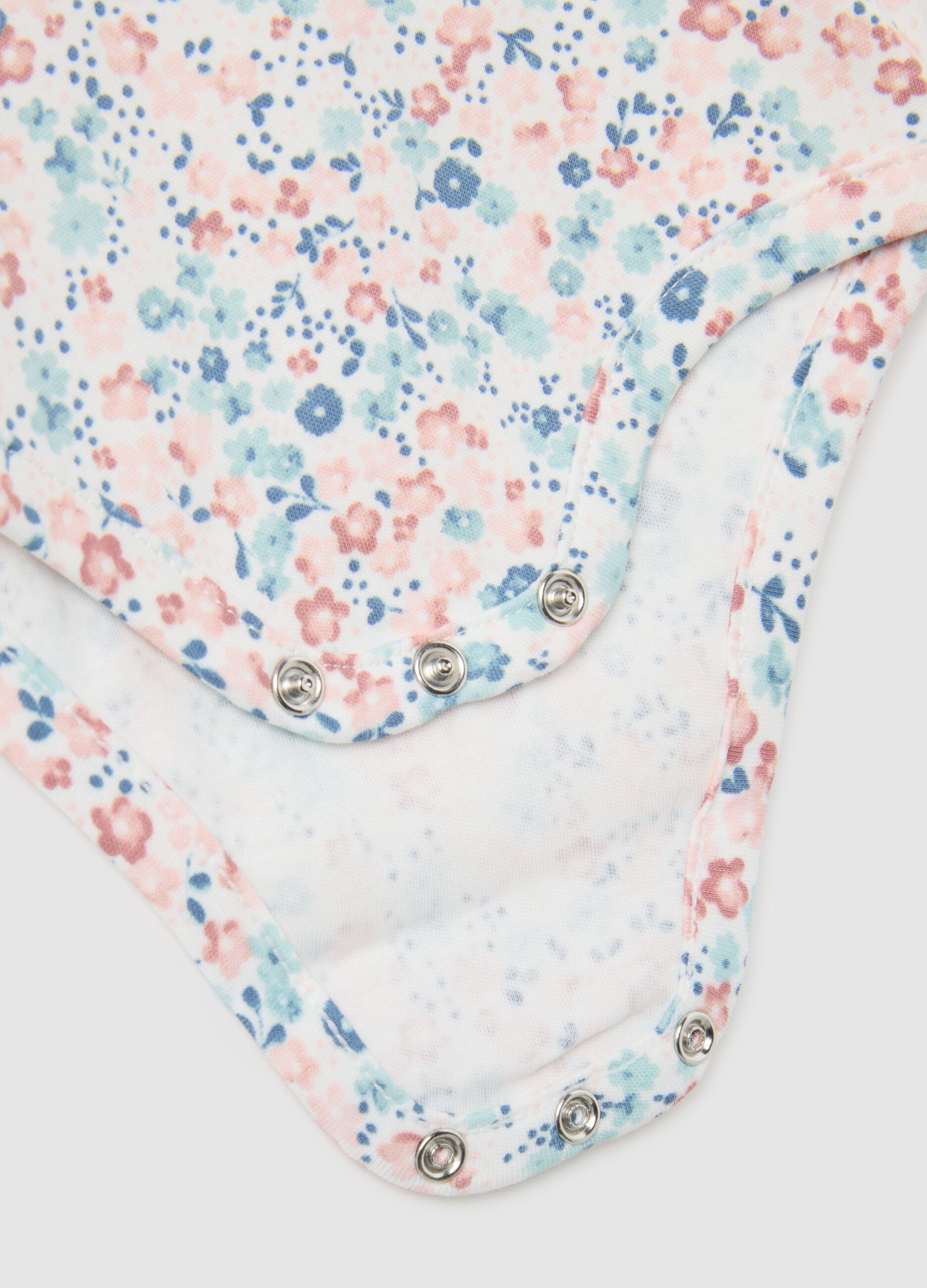 Baby girl's bodysuit in multicolour pure cotton with ruffle collar