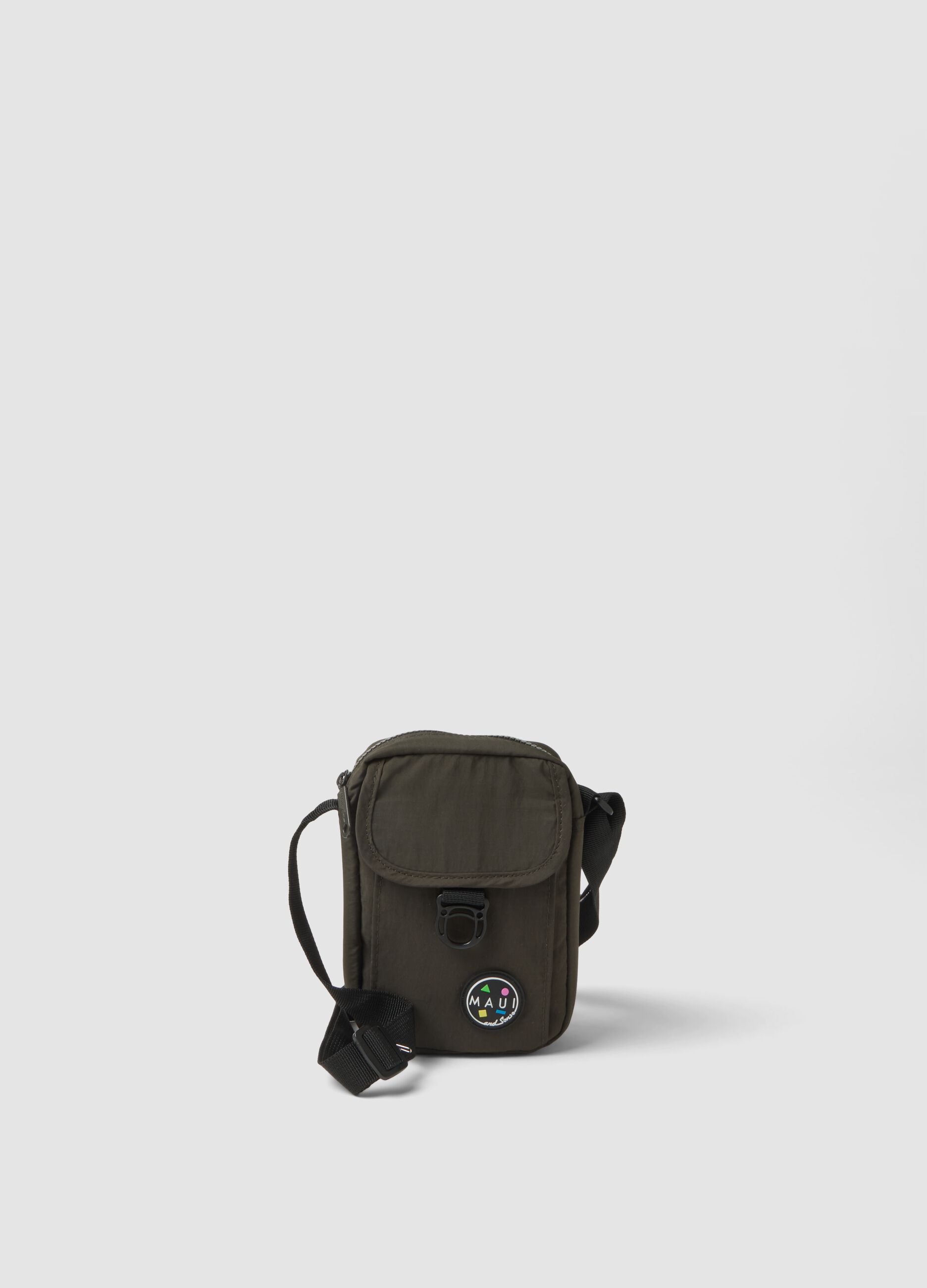 Green crossbody bag with zip closure and adjustable strap