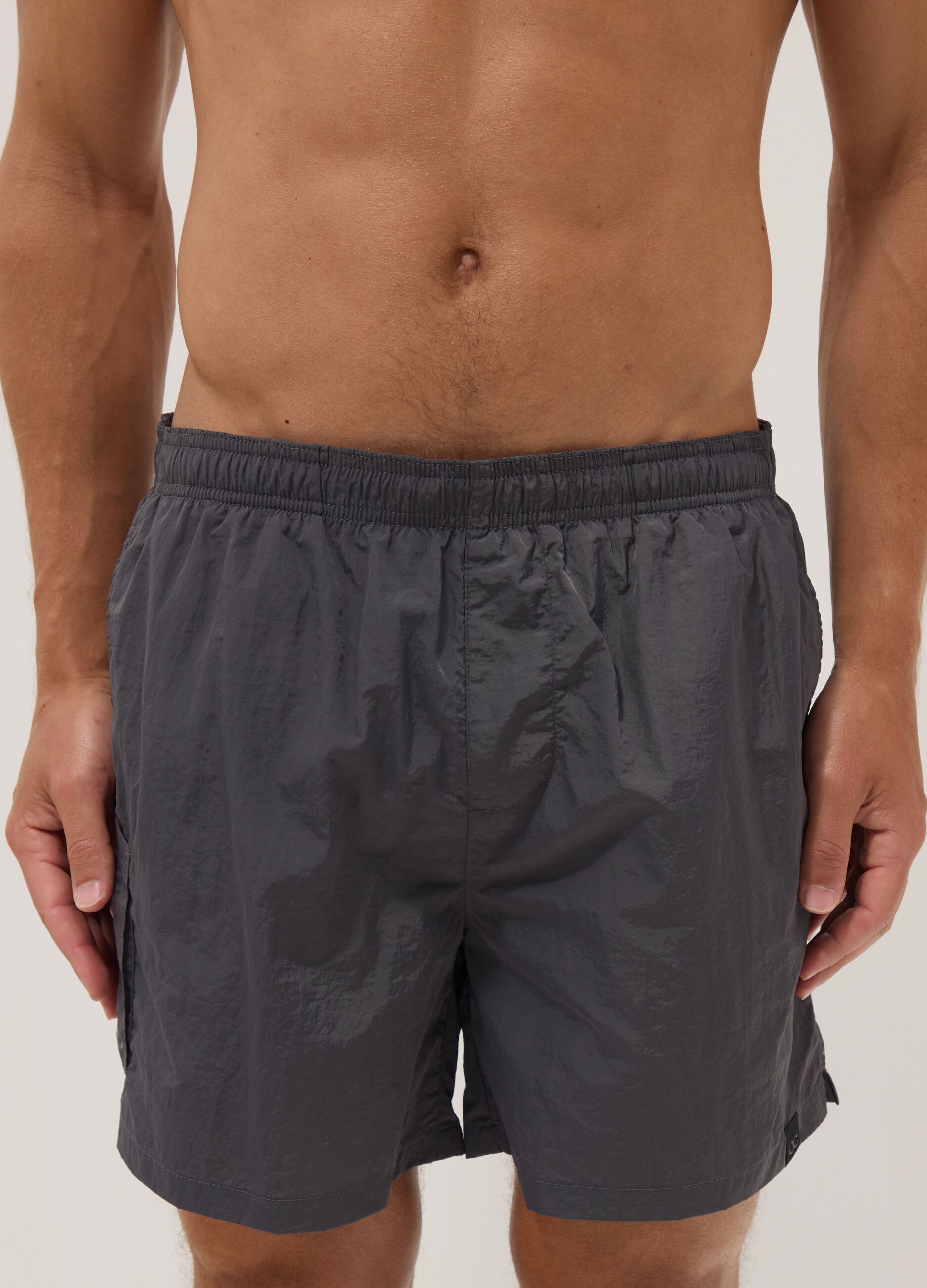 Grey swim shorts with elasticated waistband