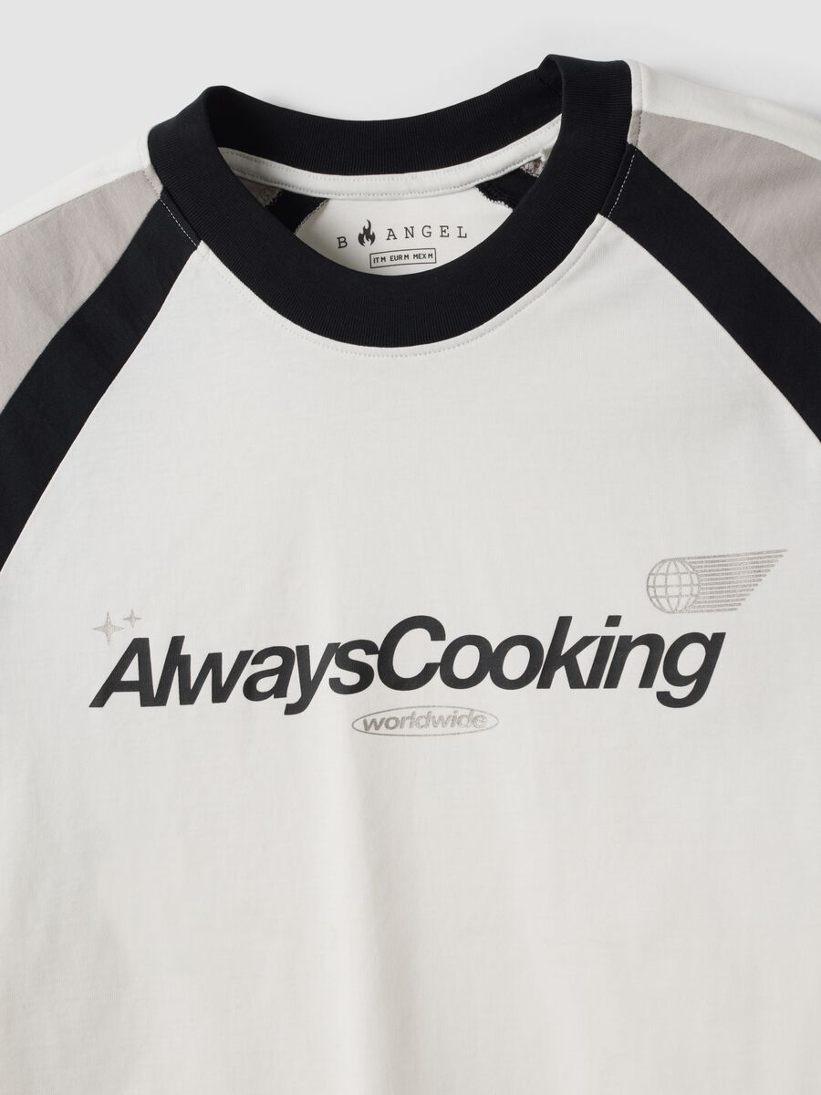 White pure cotton crew-neck T-shirt with &ldquo;Always Cooking&rdquo; slogan_1