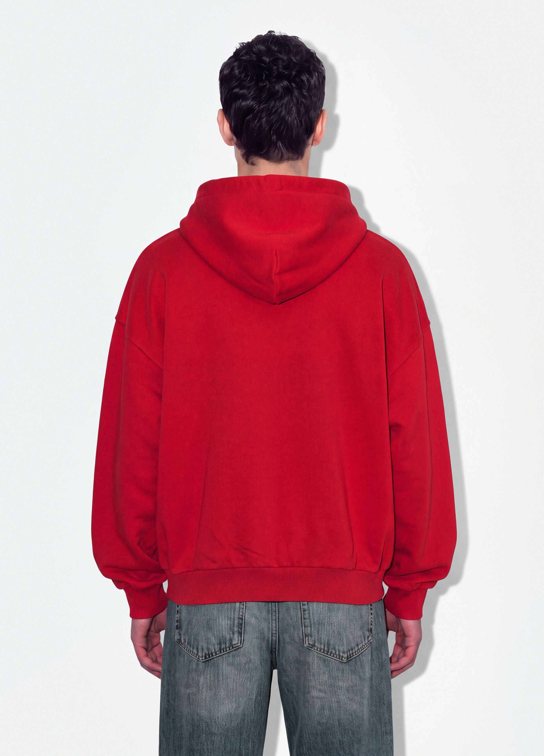 Red 100% cotton sweatshirt with oversized crew neck fit
