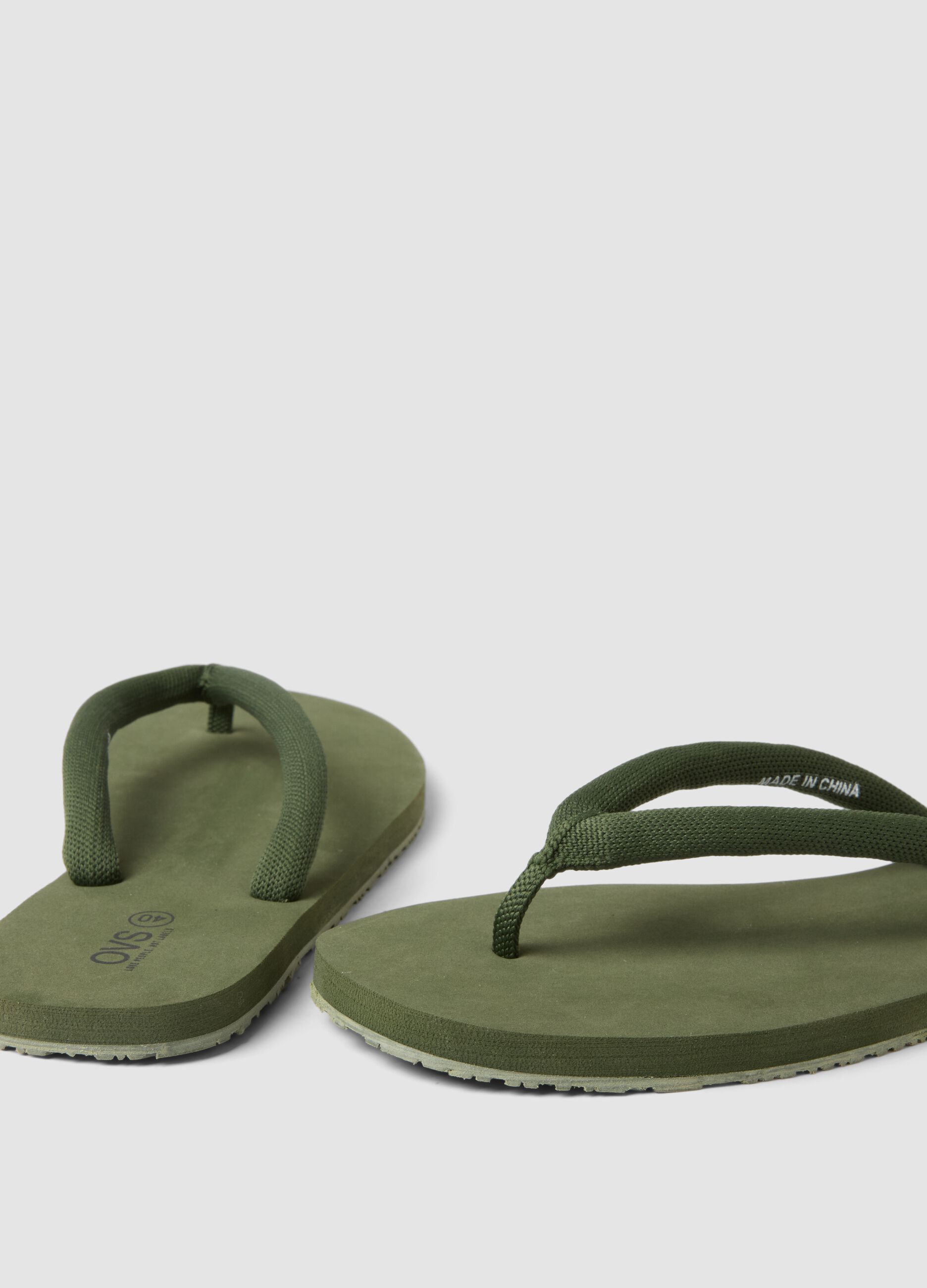 Green flip-flops with thick straps