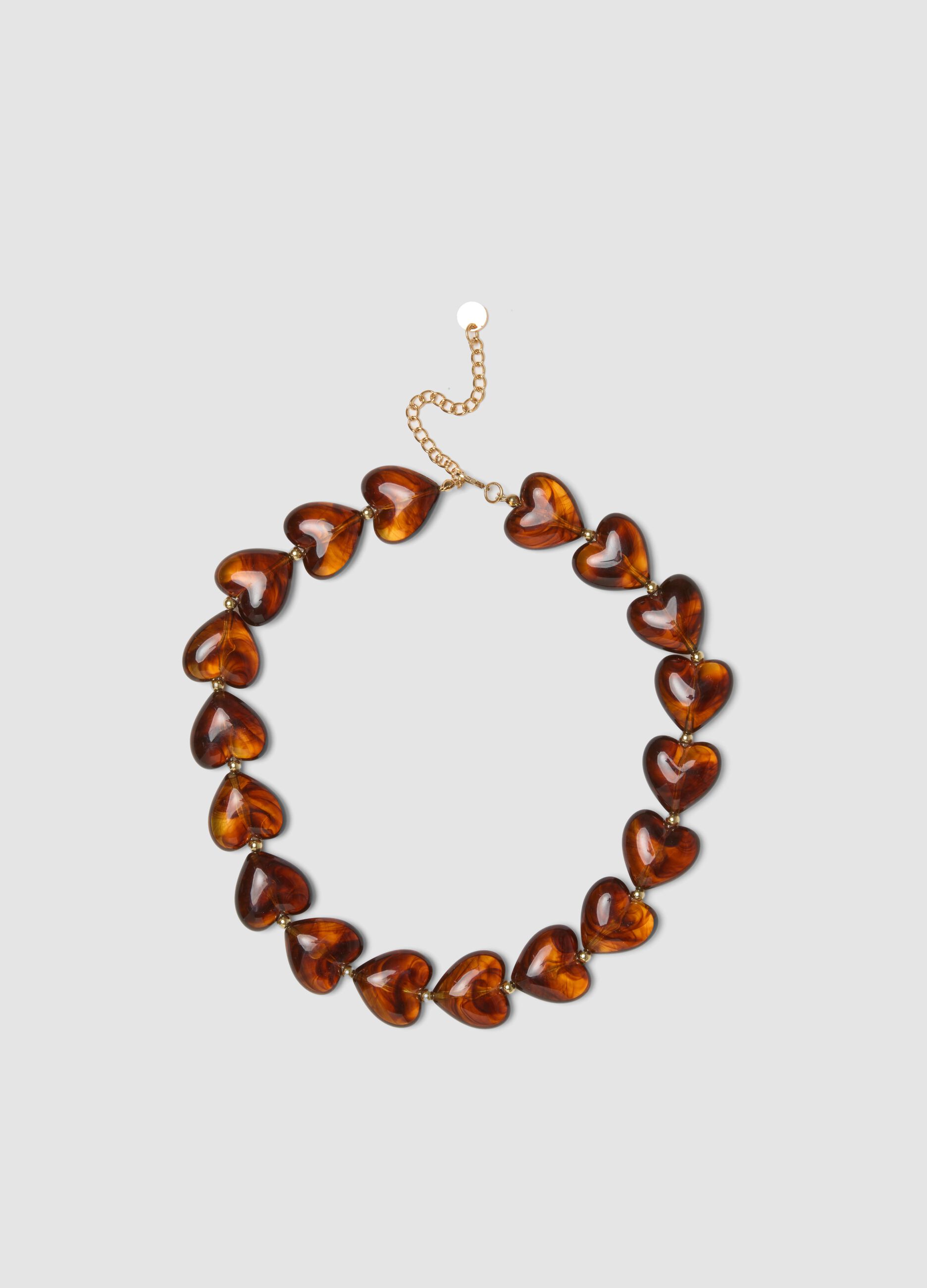 Orange necklace with marbled-effect hearts