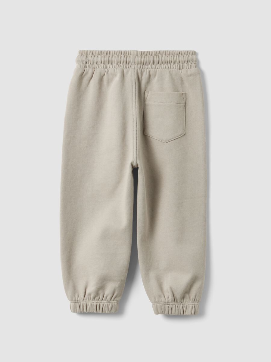 Grey jogger trousers in pure organic cotton with drawstring for baby boy_1
