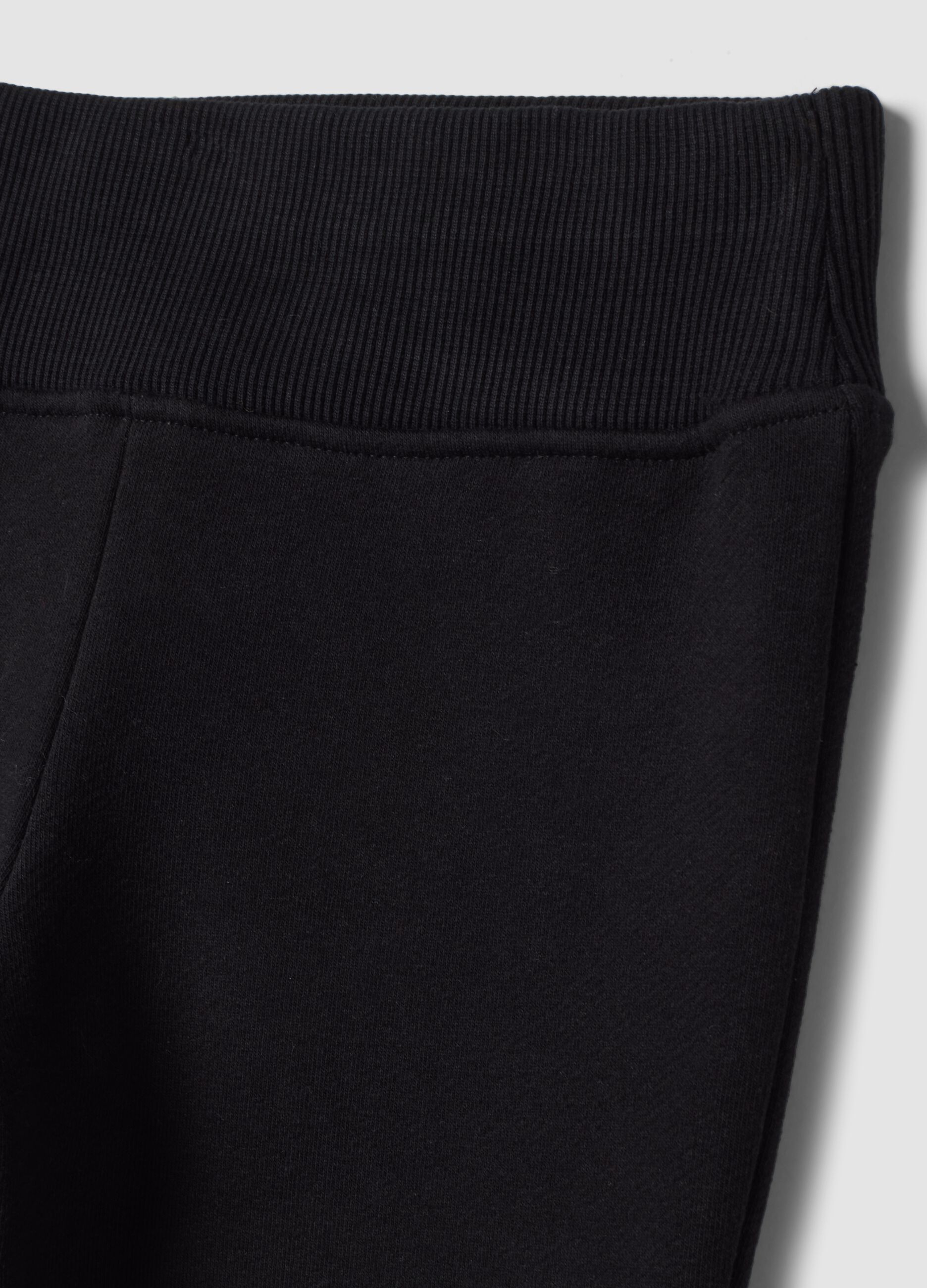 Black flared trousers in stretch cotton
