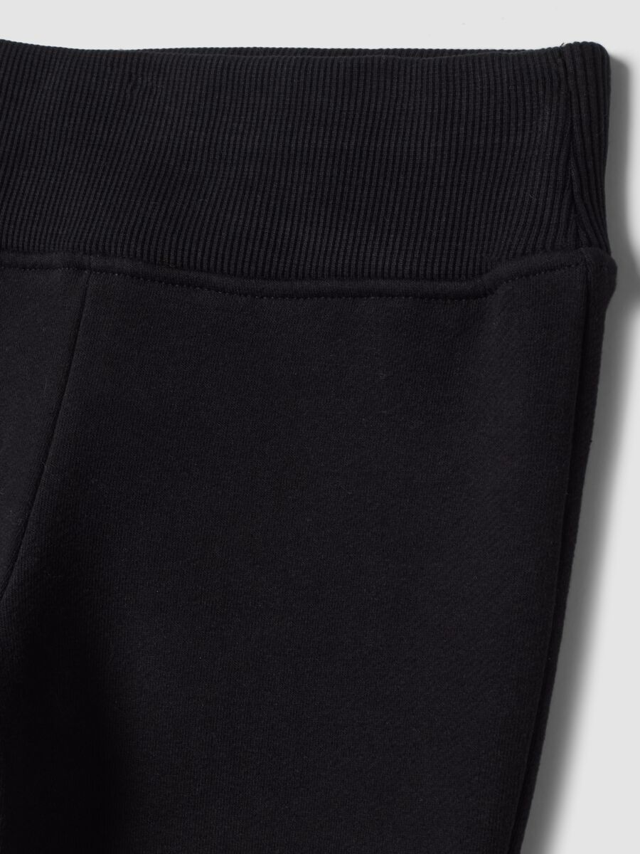 Black flared trousers in stretch cotton_1