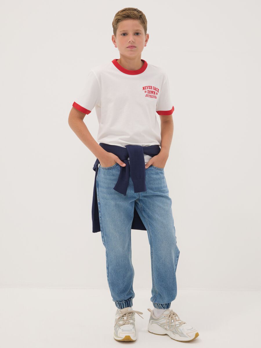 Blue denim jogger jeans in a cotton and viscose blend for boys_1