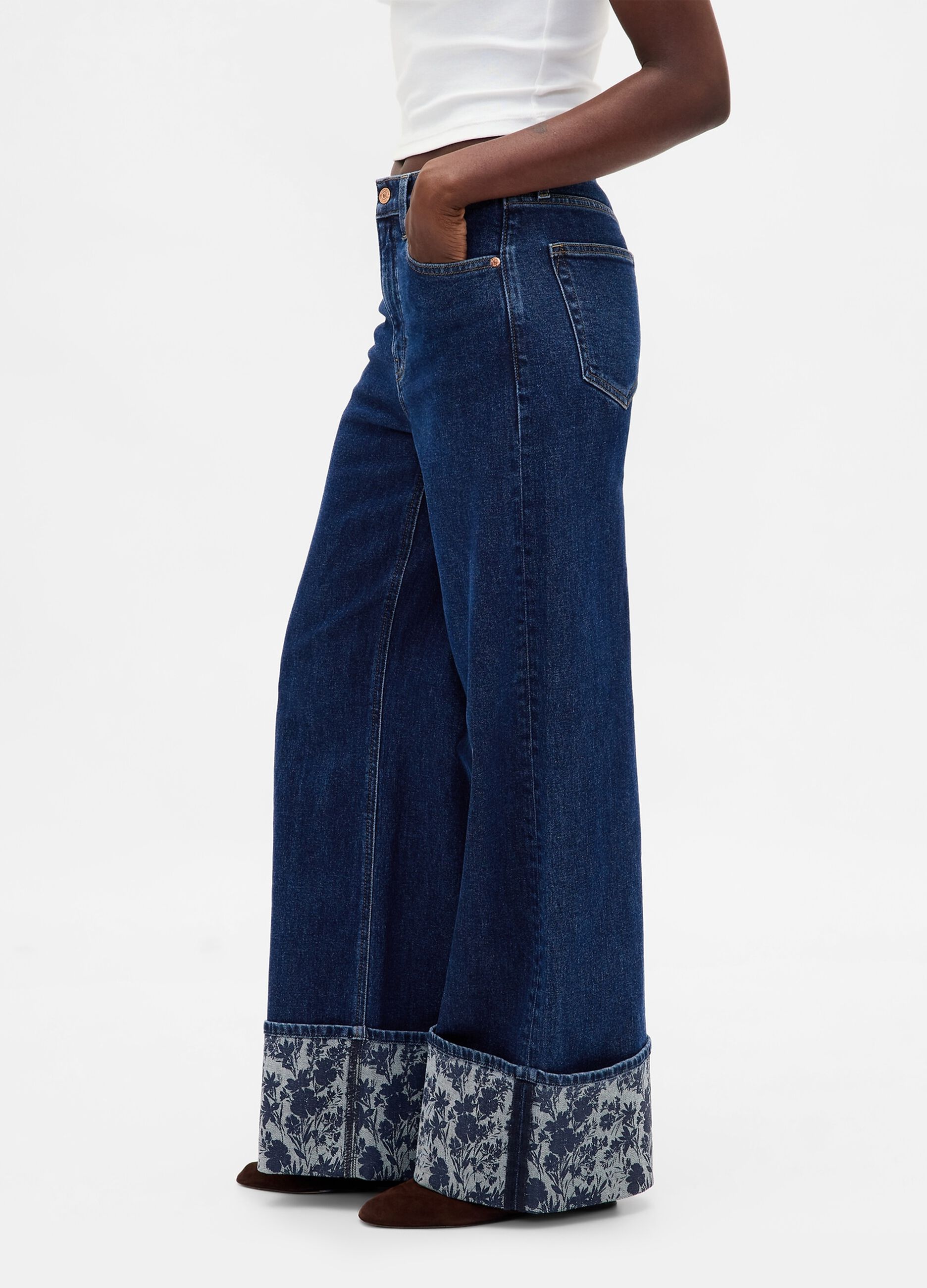 Wide denim trousers with floral turn-up