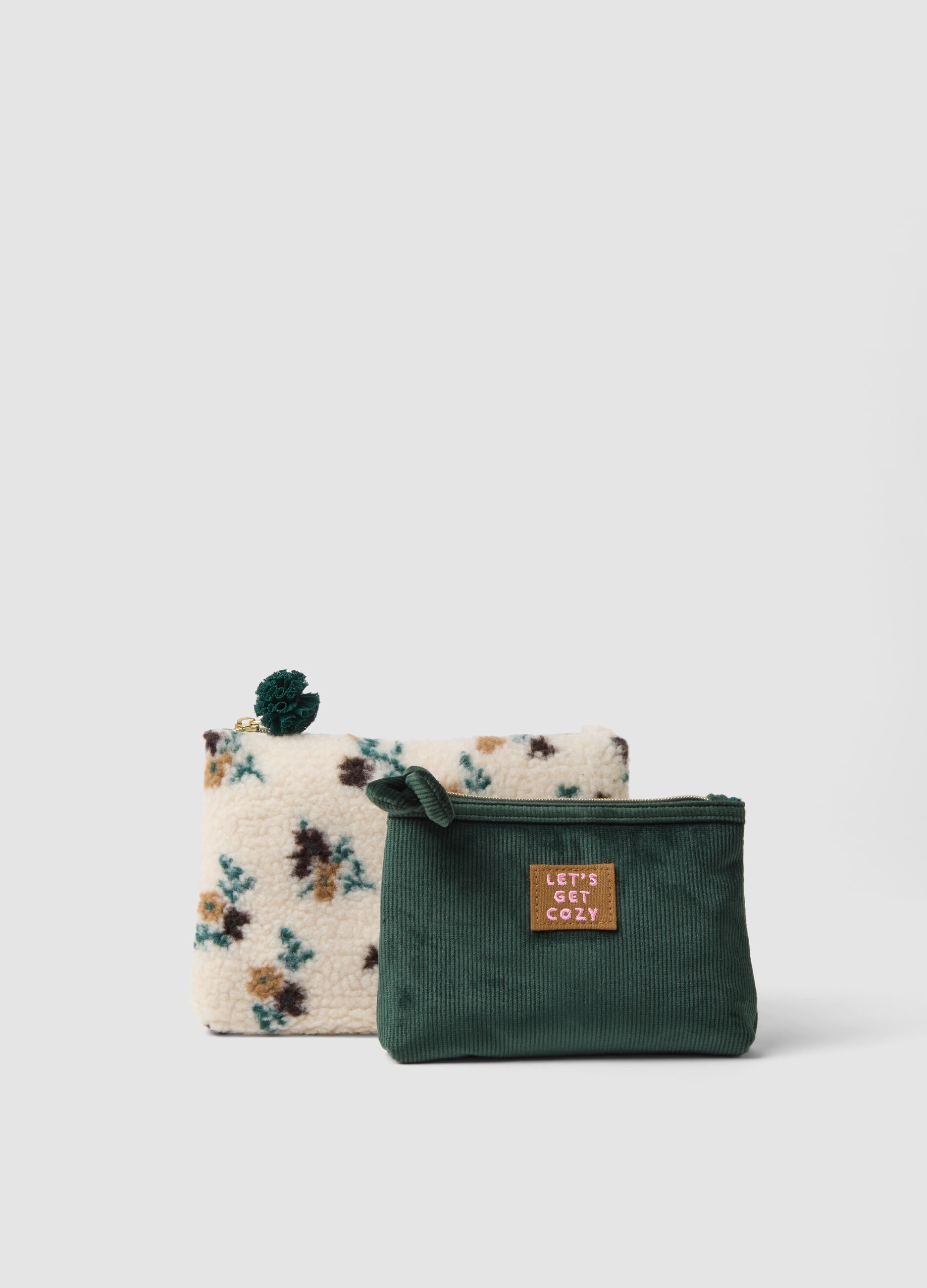 Set di due pochette bianche e verde con fantasia floreale